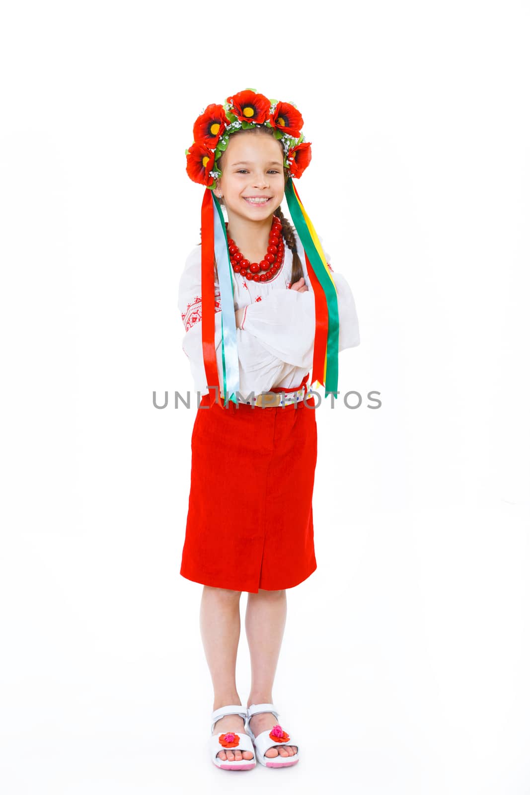 A little girl in Ukrainian national dress on the white background