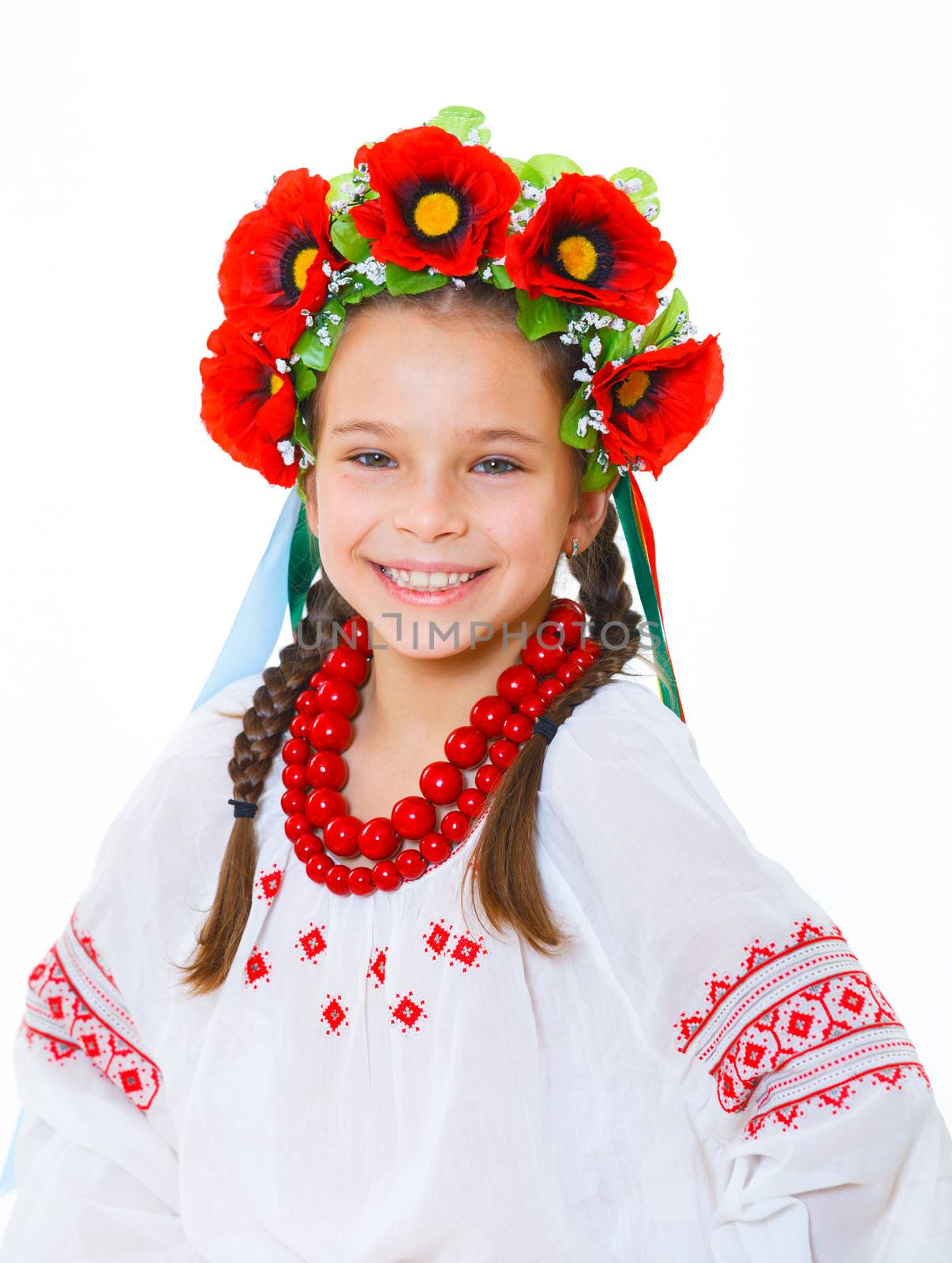 A little girl in Ukrainian national dress on the white background