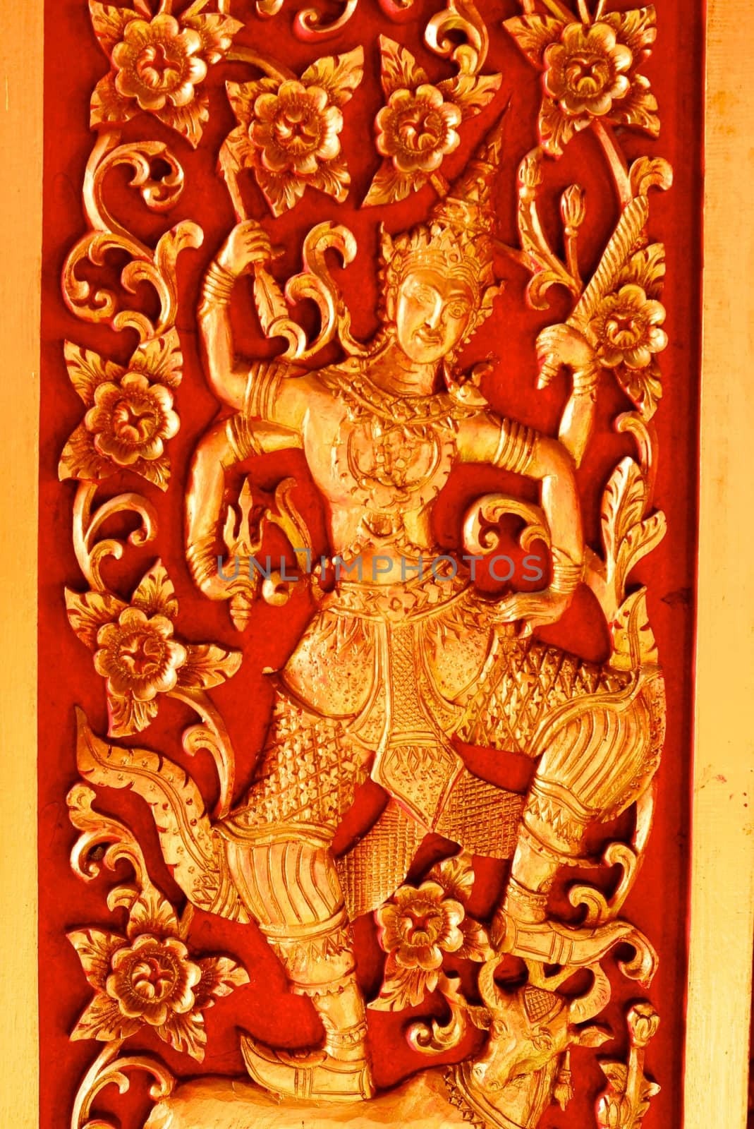 thai traditional four hands angel sculpture mixing with thai pattern around pagoda,Lampang temple,Thailand