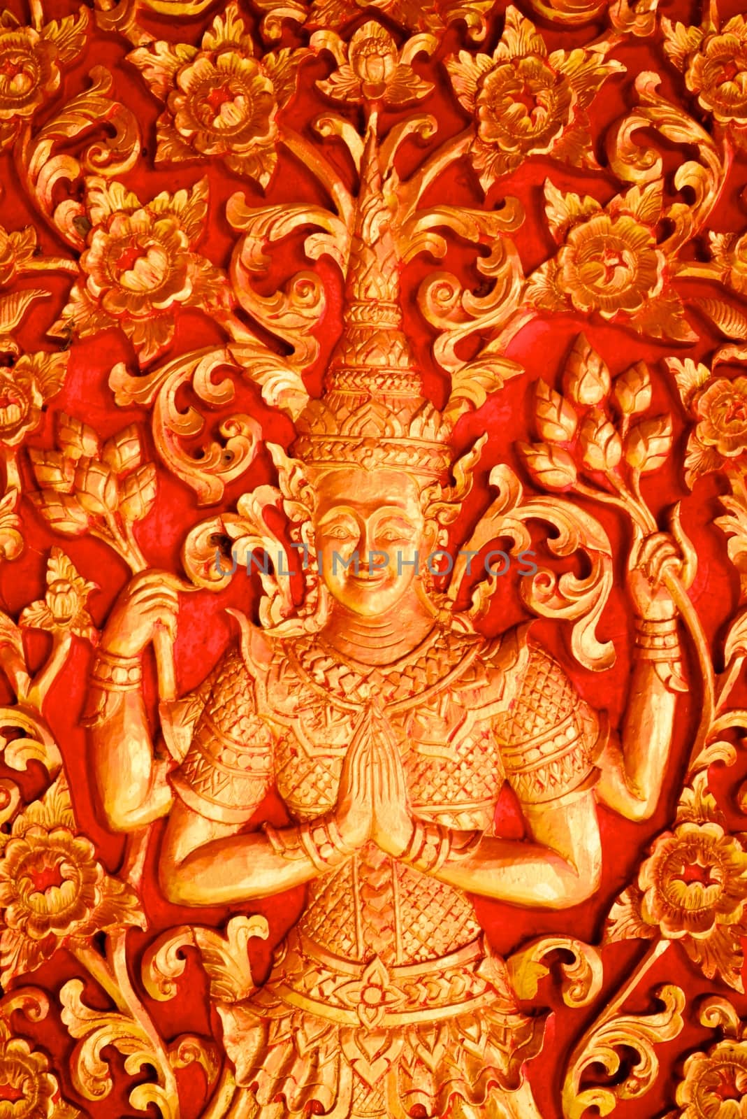 thai traditional four hands angel sculpture mixing with thai pattern around pagoda,Lampang temple,Thailand
