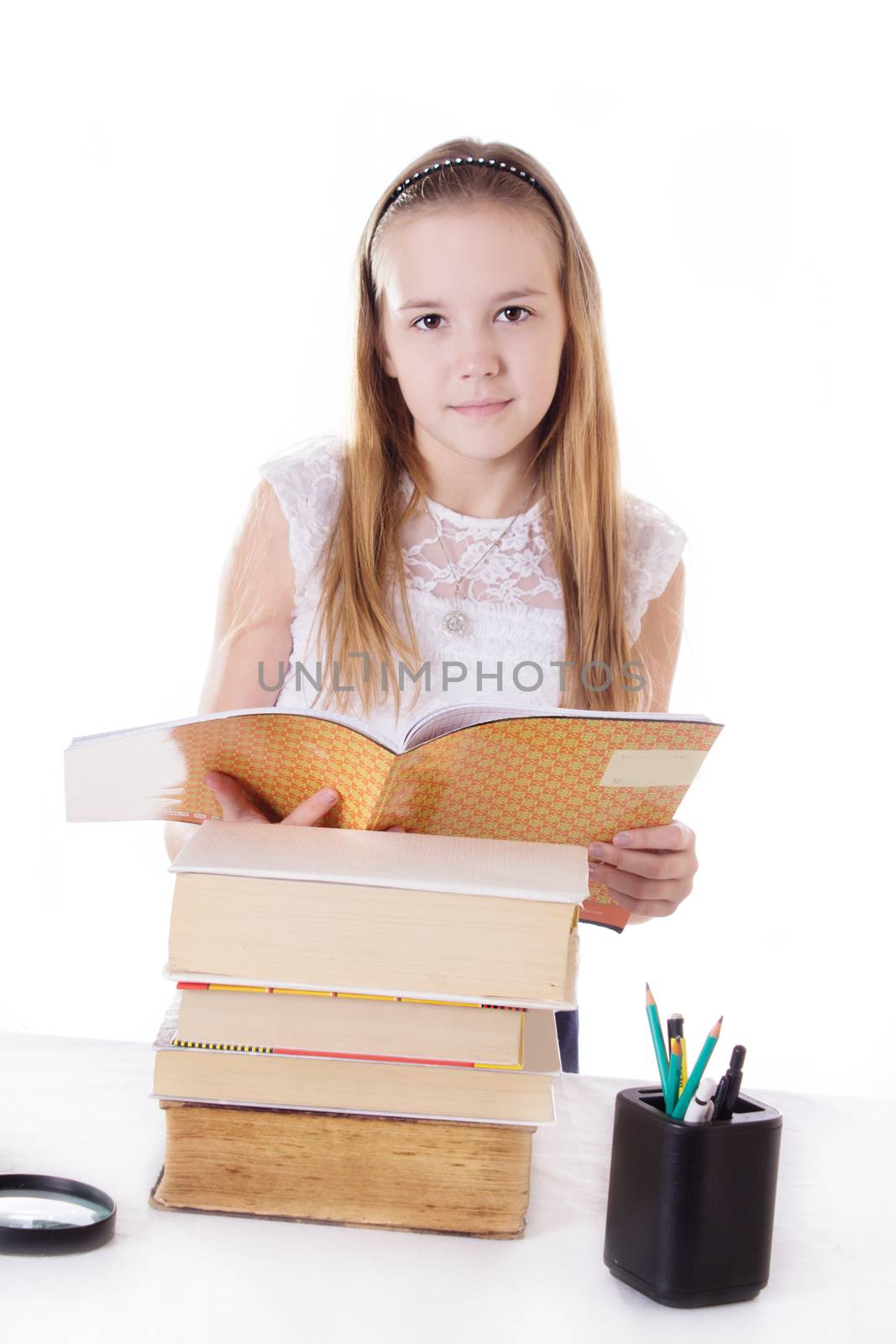 Cute schoolgirl with pile of books isolated on white