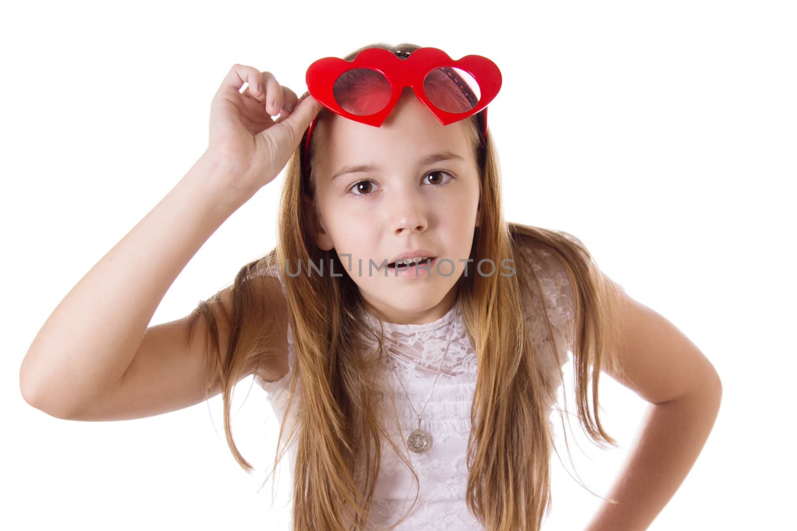 Looking-up surprised girl with funny glasses heart-shaped isolated on white