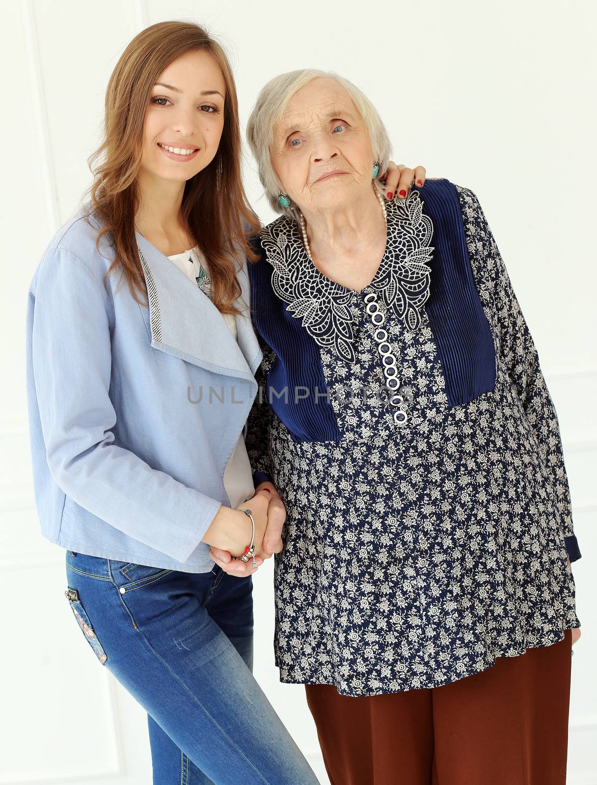 Elderly woman and beautiful granddaughter
