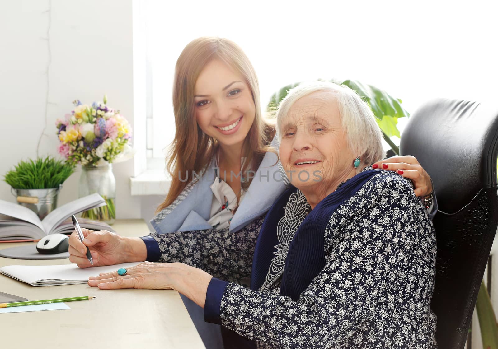 Elderly woman and beautiful teacher