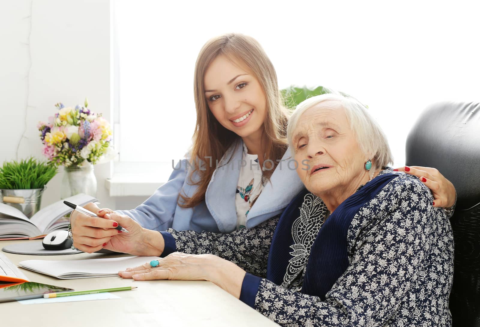 Elderly woman and beautiful teacher