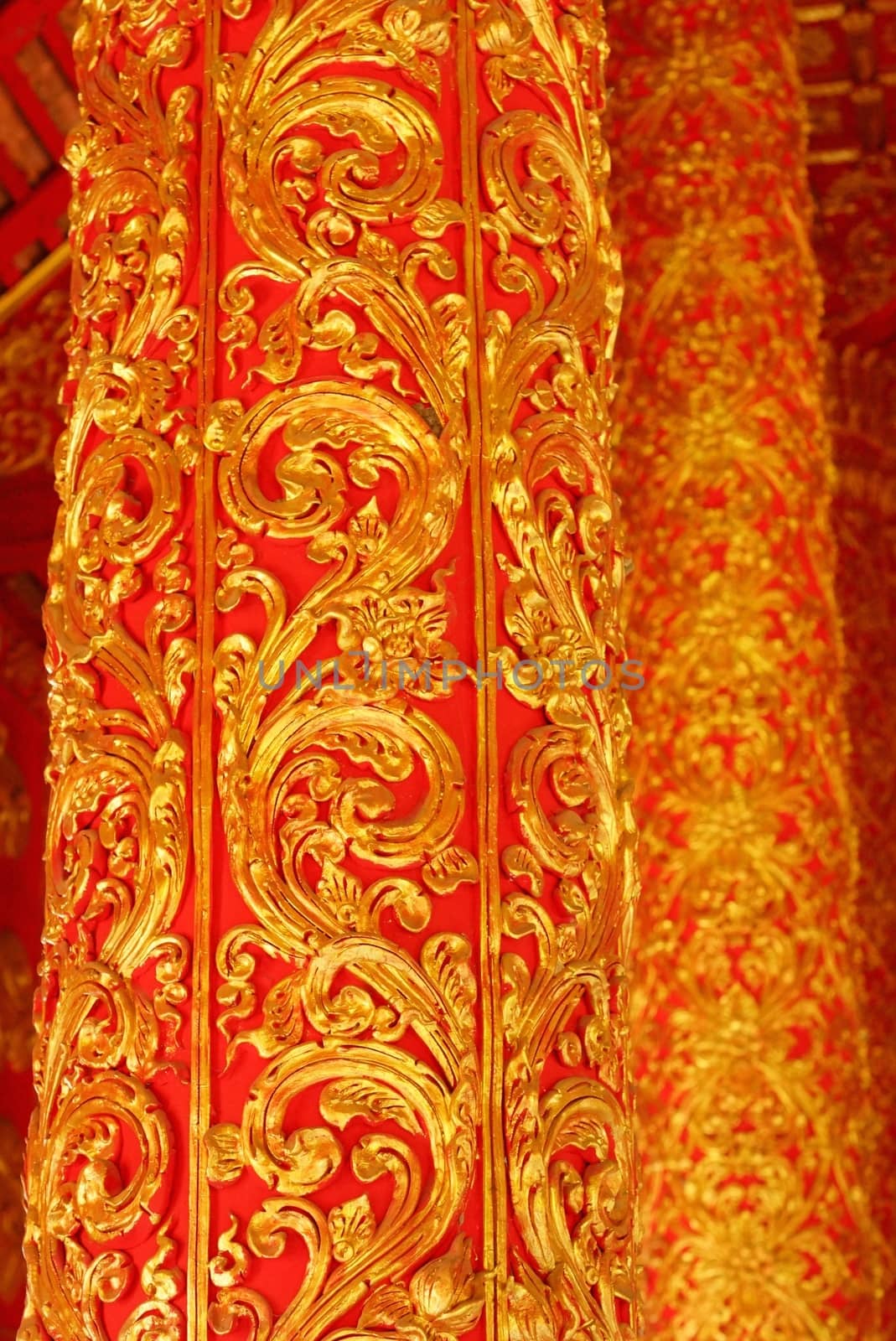 high complicated stucco work showing of traditional thai pattern that decorated with mirror and precious stone,Lampang temple,Thailand