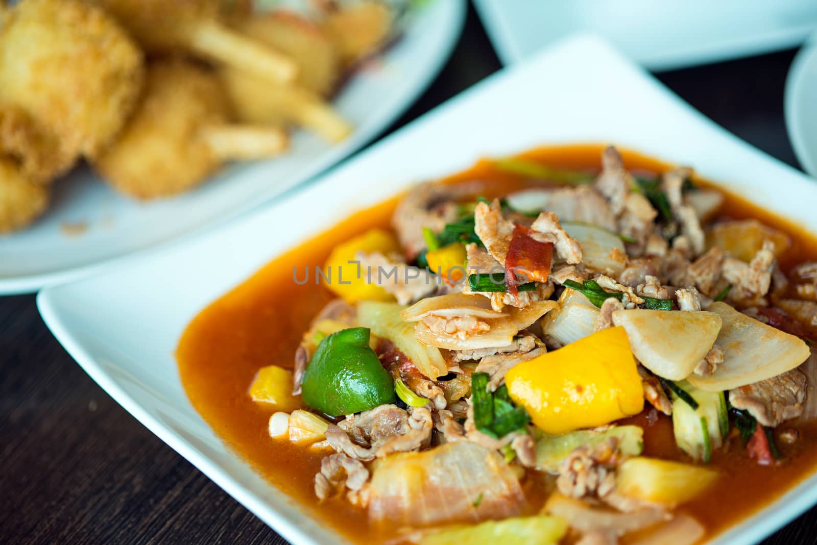 fried pork with sweet peppers, Thai food  by Yuri2012