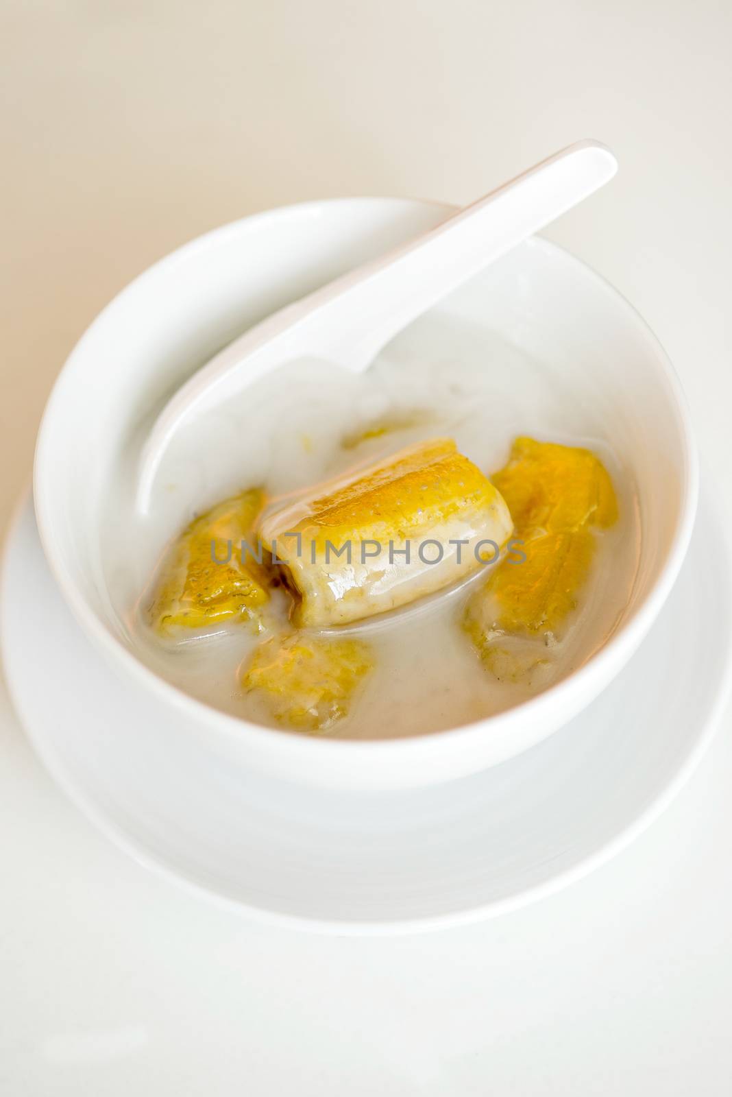 banana in coconut milk,Sweet yellow banana Topped with coconut m by Yuri2012