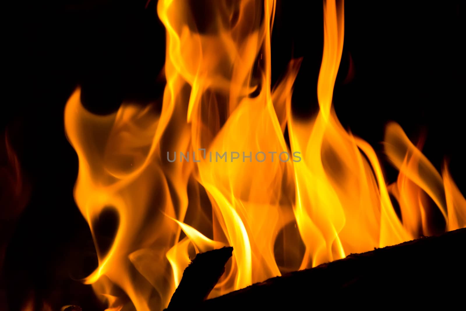 Photo with red flame on black background
