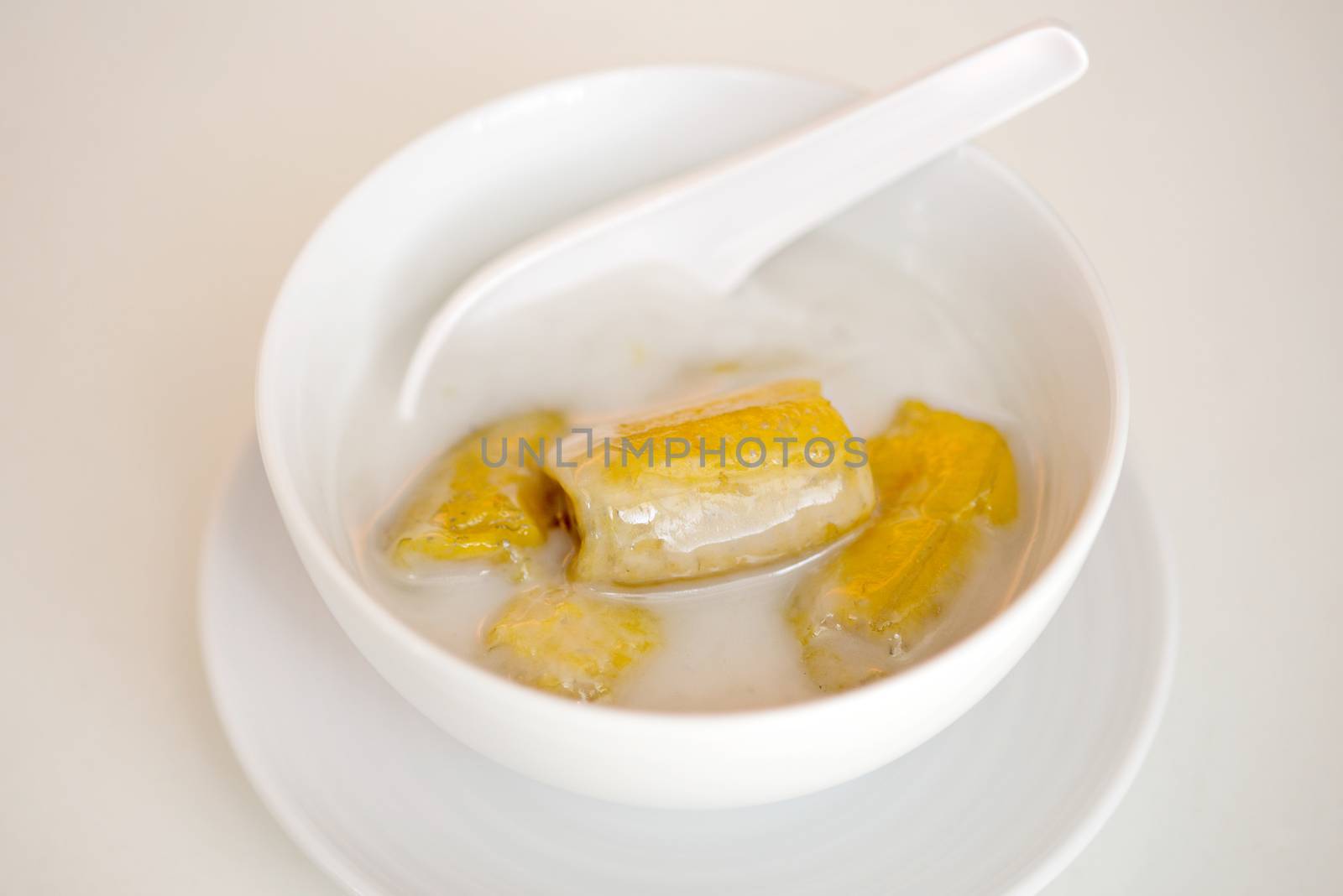 banana in coconut milk,Sweet yellow banana Topped with coconut m by Yuri2012