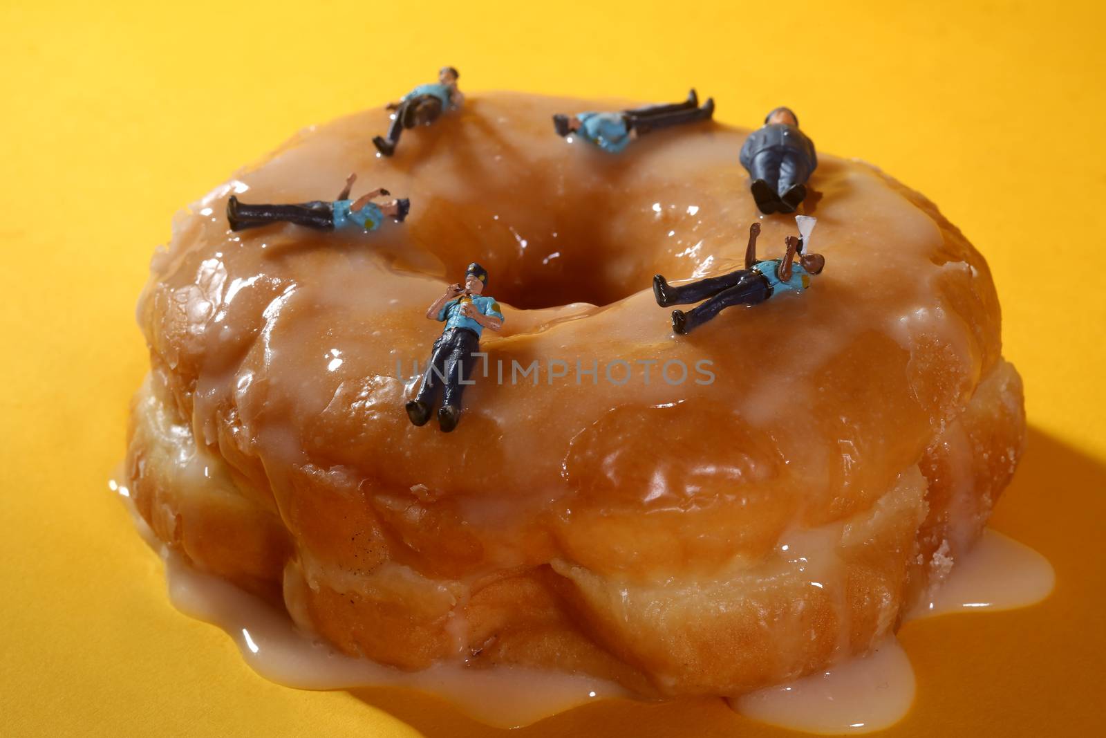 Police Officers in Conceptual Food Imagery With Donuts by tobkatrina