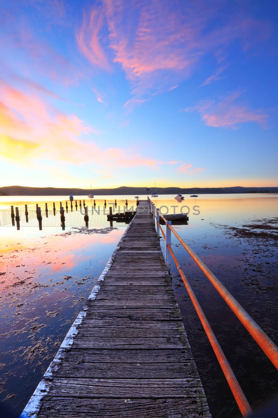 A pretty summer sunset at Yattalunga on the NSW Central Coast.   The long jetty leads to a pool and public wharf.  