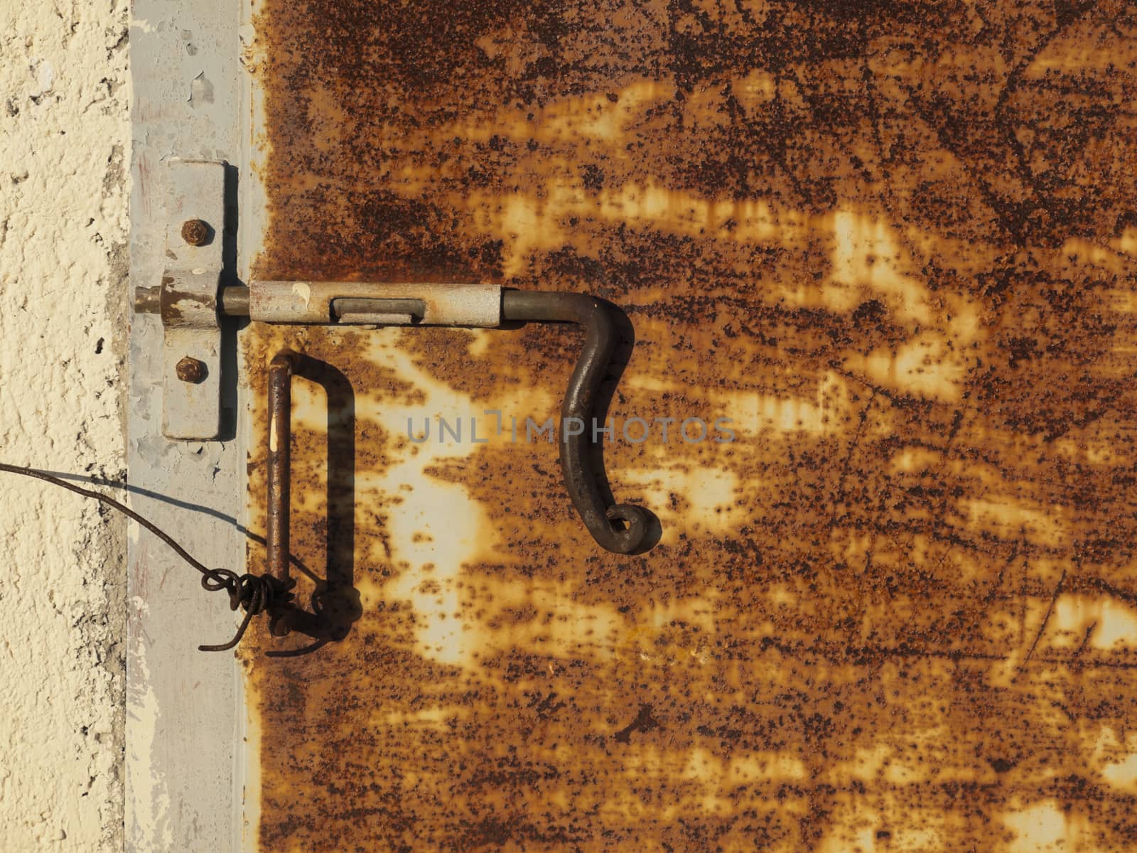 Old rusty door with rusted handle     