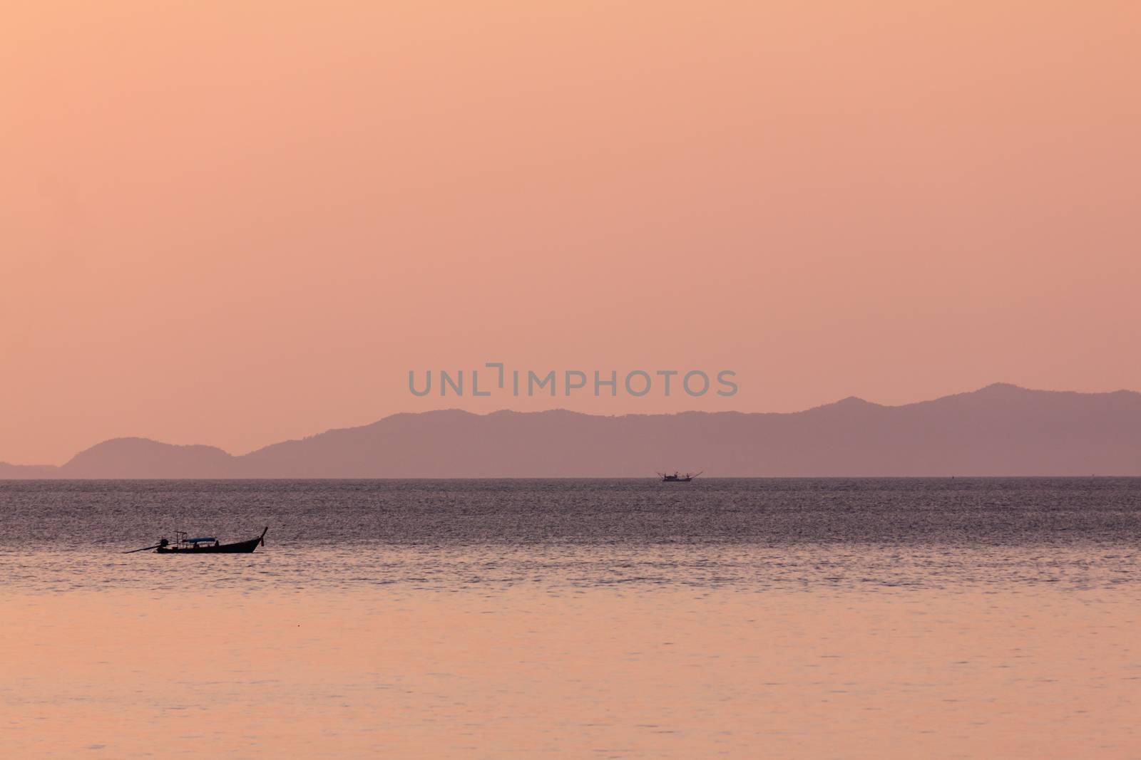 Fisherman 's boat in sea at Loh Dalum Bay,Phi Phi island Krabi,Thailand.(in warm tone)