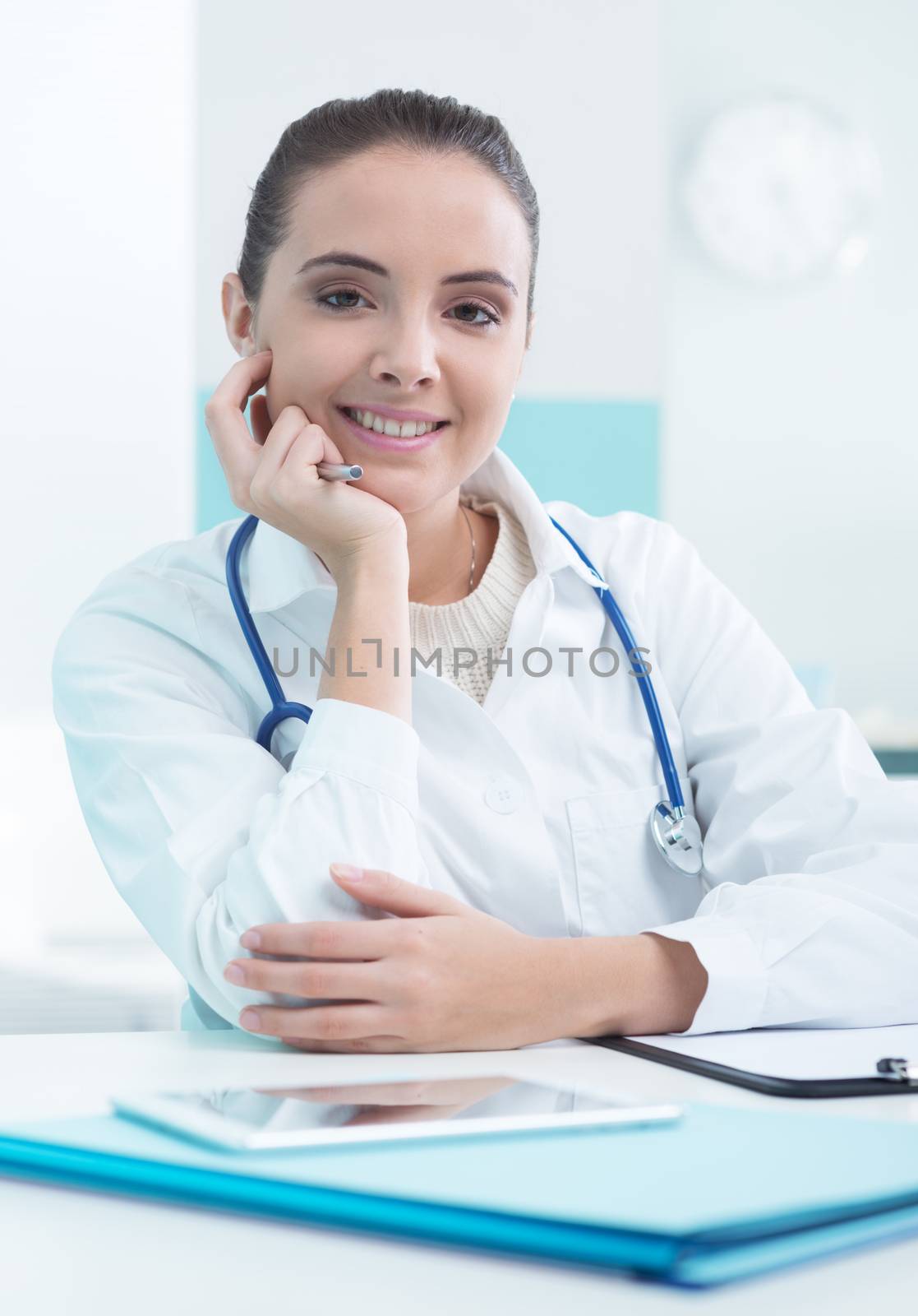 Portrait of a beautiful young female doctor or pharmacist in office