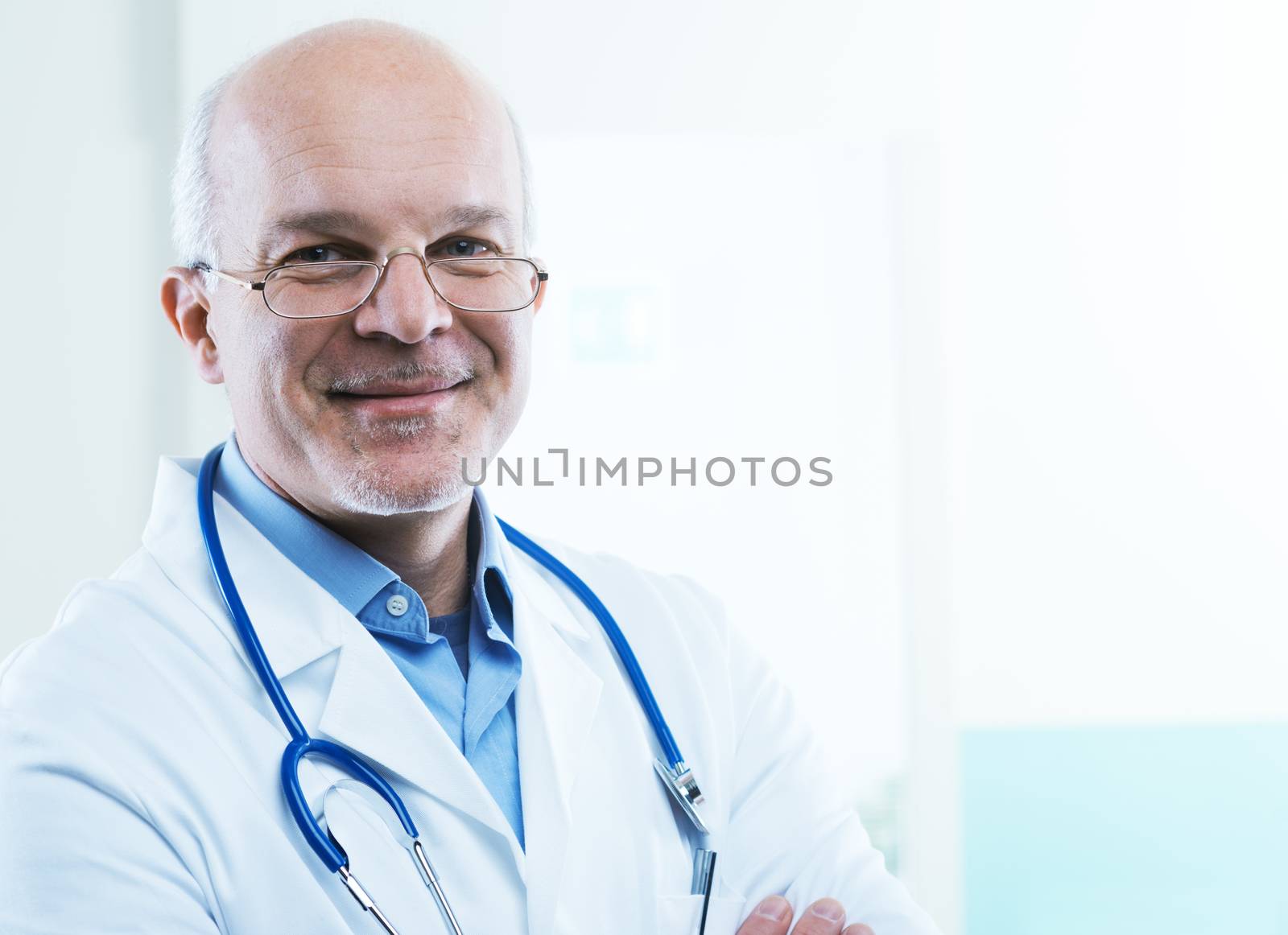 Friendly doctor smiling and looking at camera.
