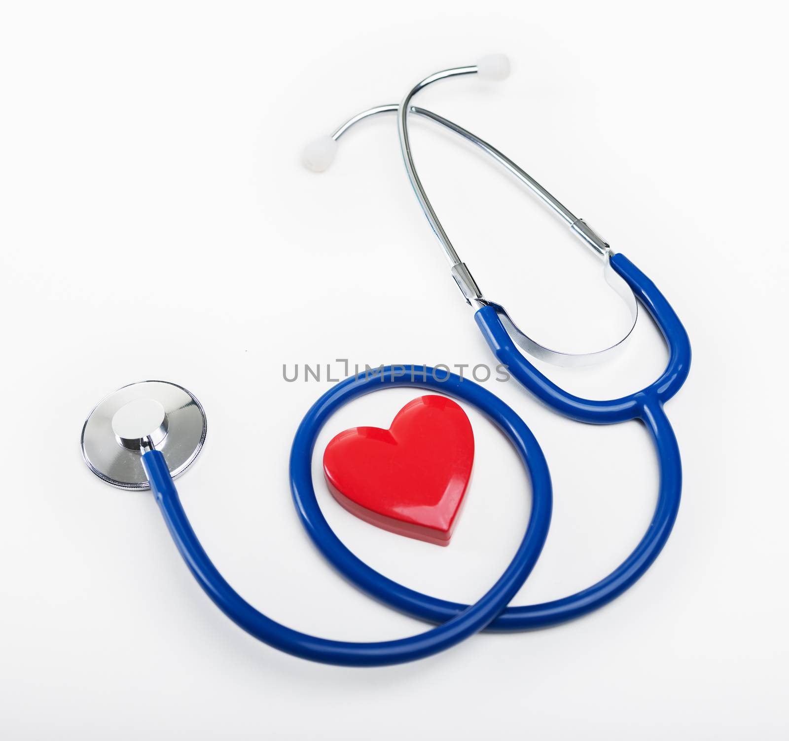 Stethoscope and heart shaped object by stokkete