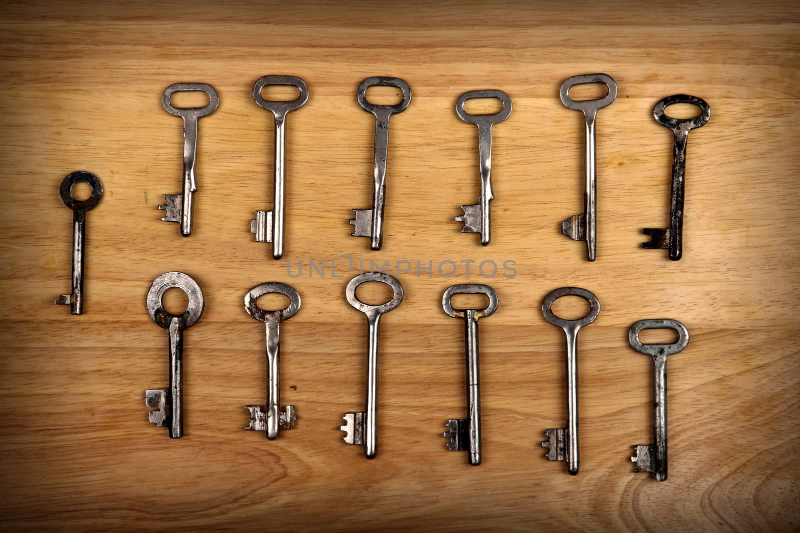 Old Keys Set on the Wooden Background