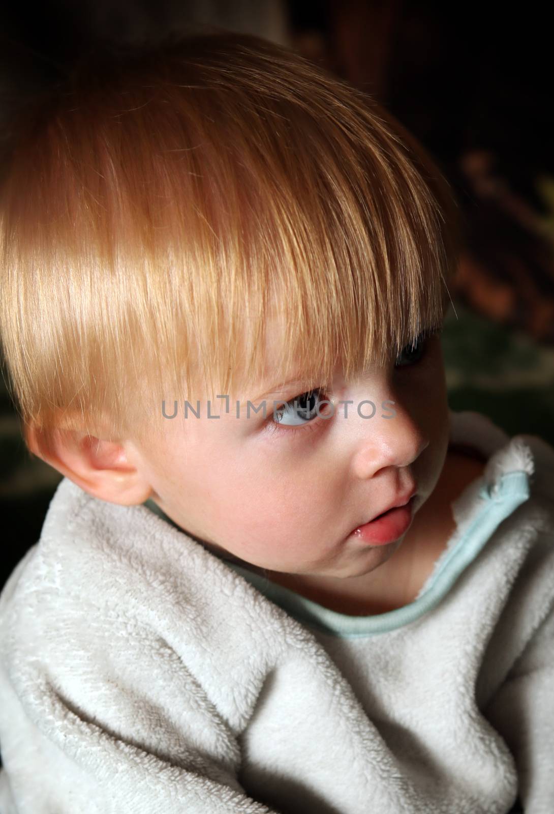 Baby Boy Portrait in the Dark Room