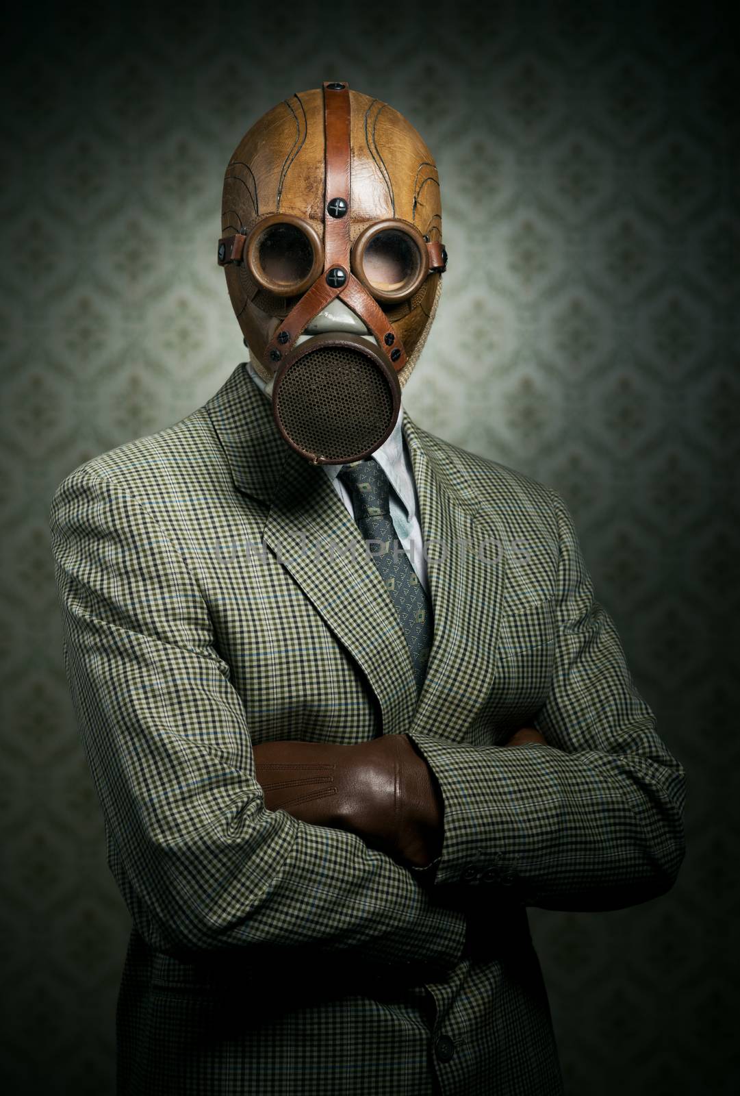 Vintage businessman wearing gas mask by stokkete