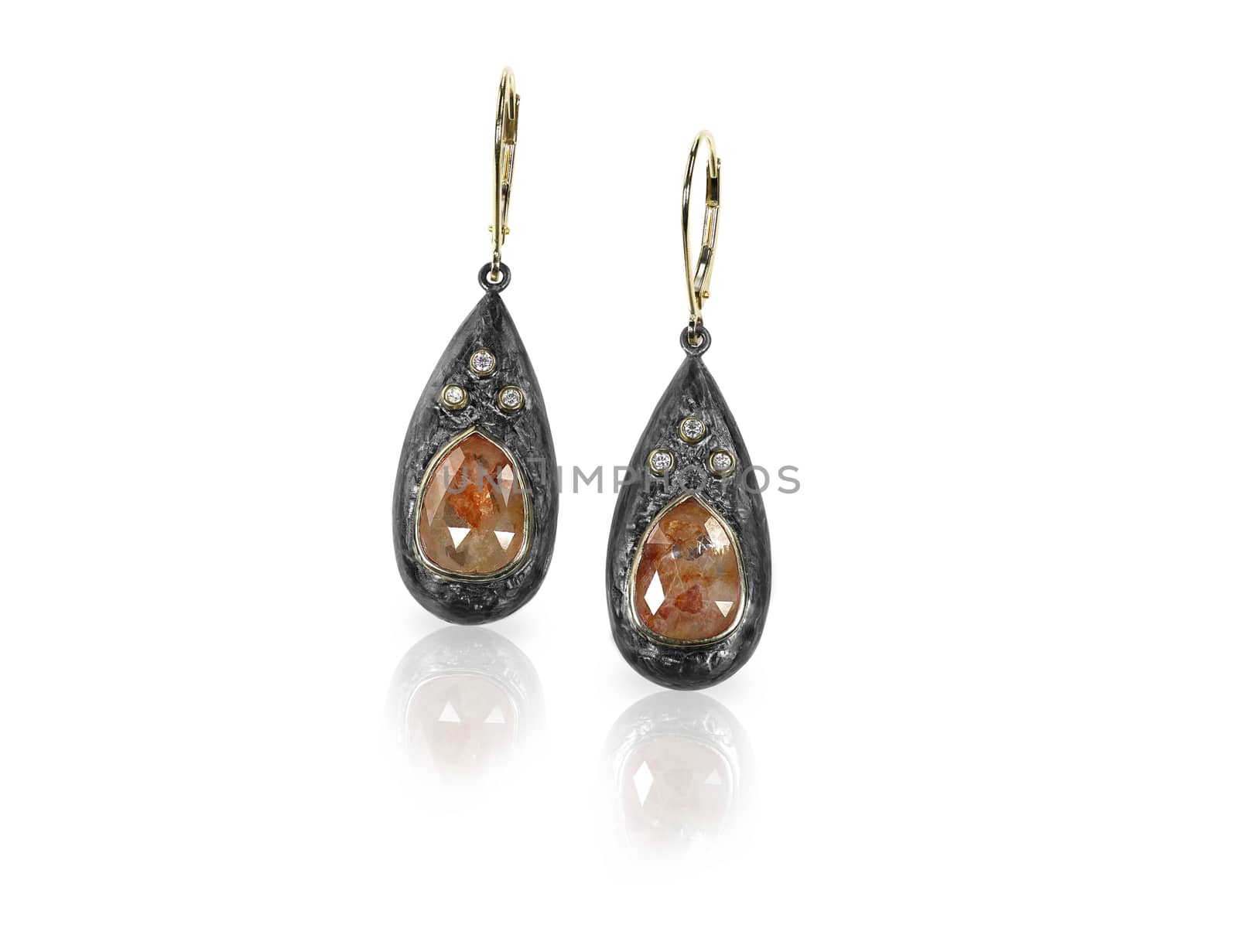 Beautiful brown diamond chocolate diamond earrings isolated on white with a reflection. 