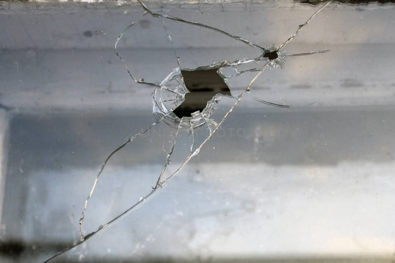 background broken window in an old house with cracks