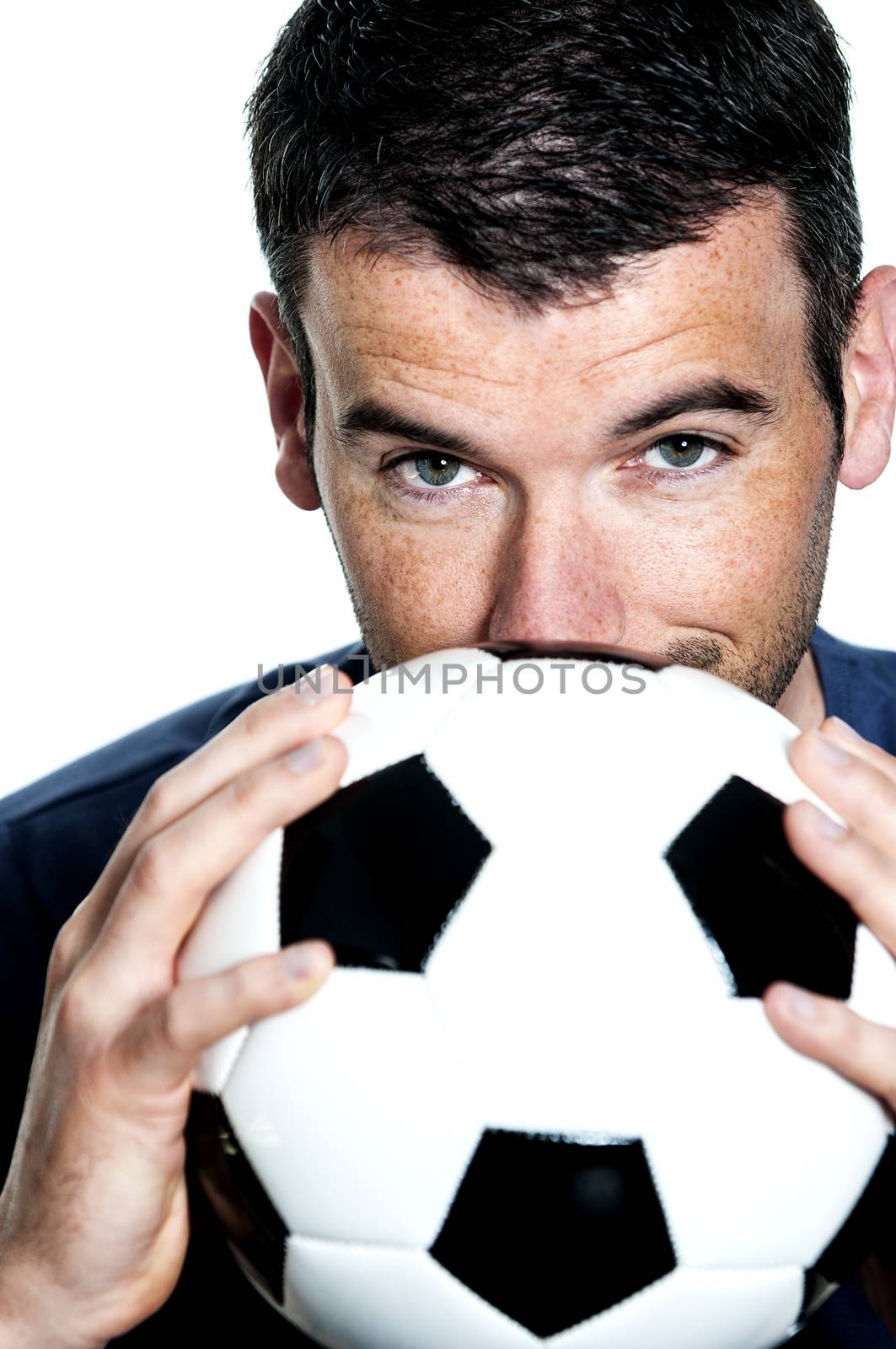 closeup of passionate soccer player with white and black balloon