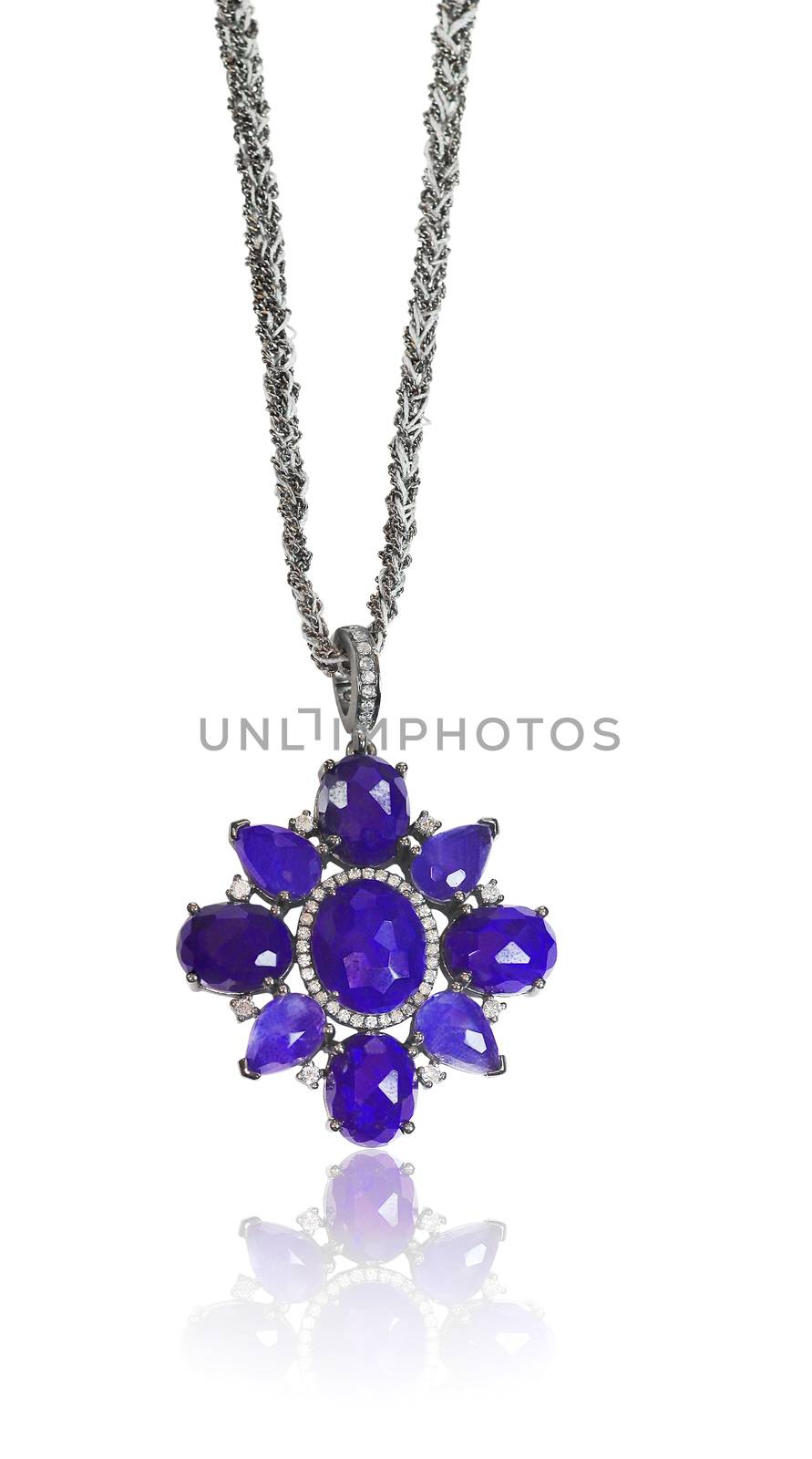 Blue Gemstone and Diamond Pendant Necklace isolated on a white background with a reflection