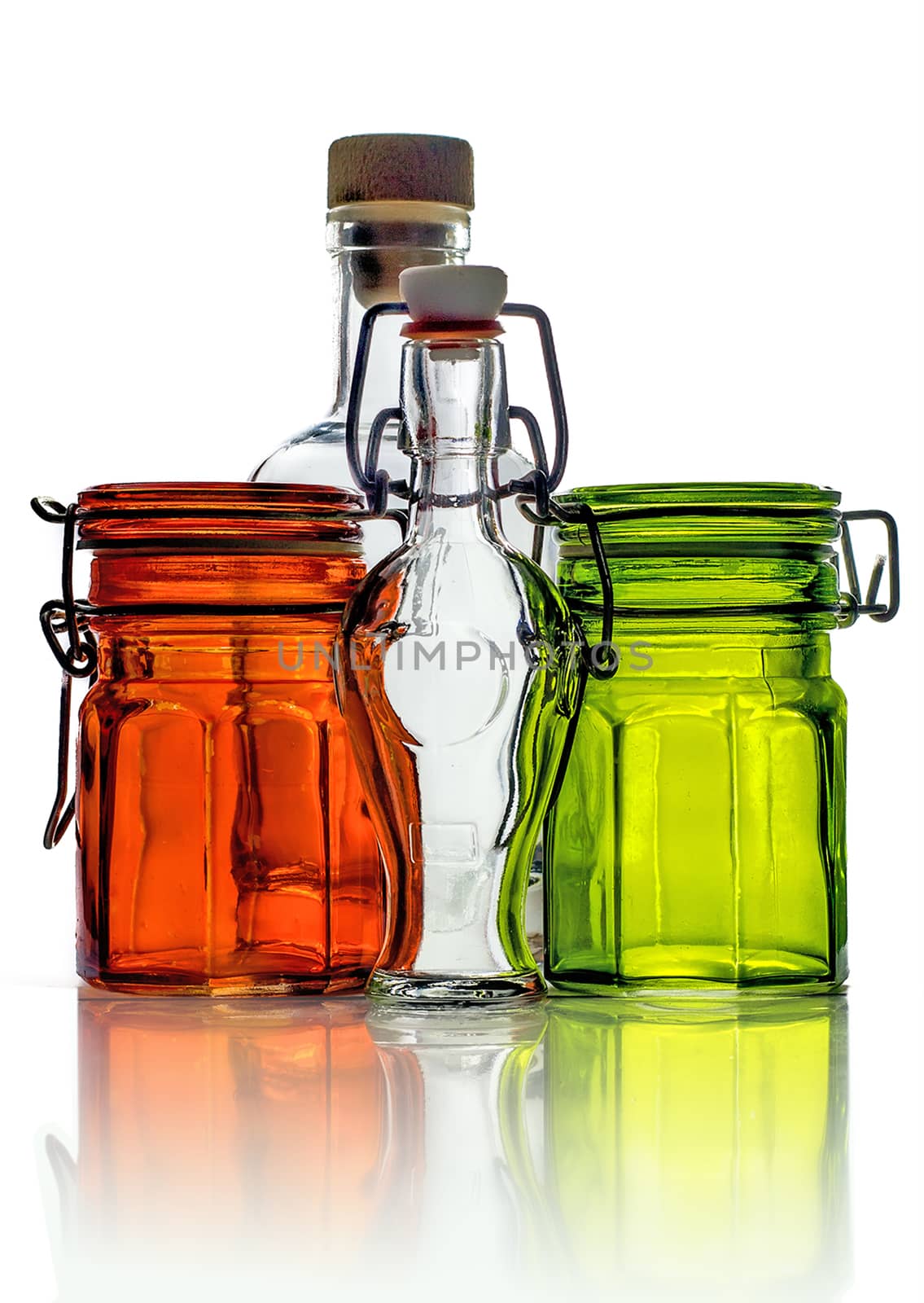 Empty glass jars and empty little glass bottles isolated on white background