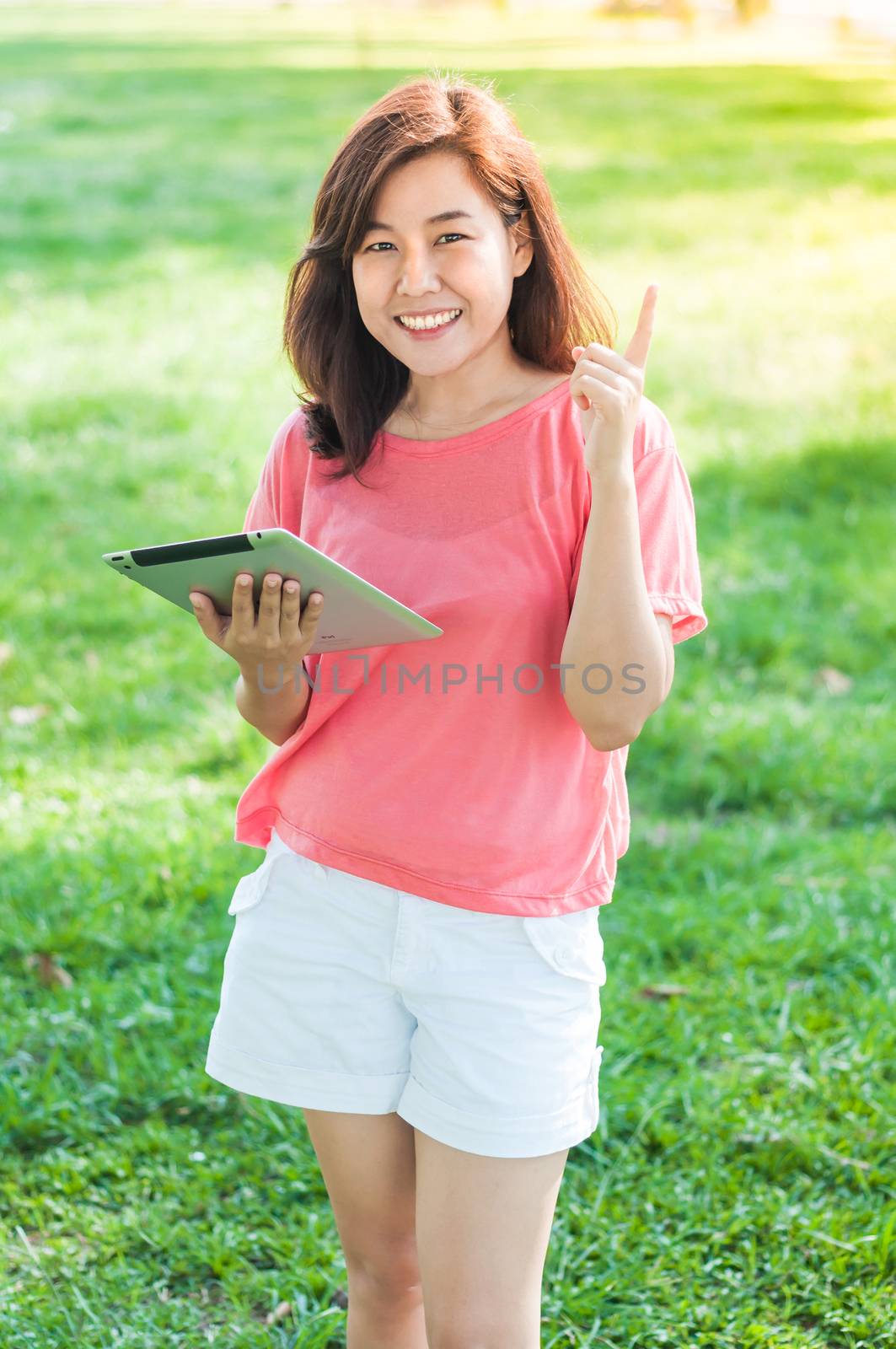 Woman Holding Digital Tablet  by TanawatPontchour