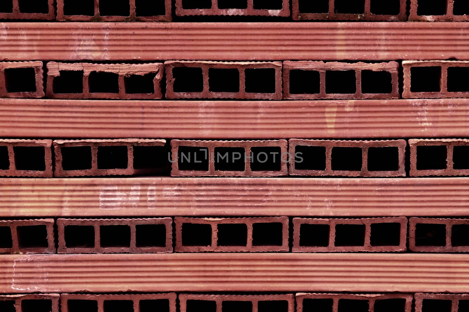 background or texture perforated red terracotta bricks