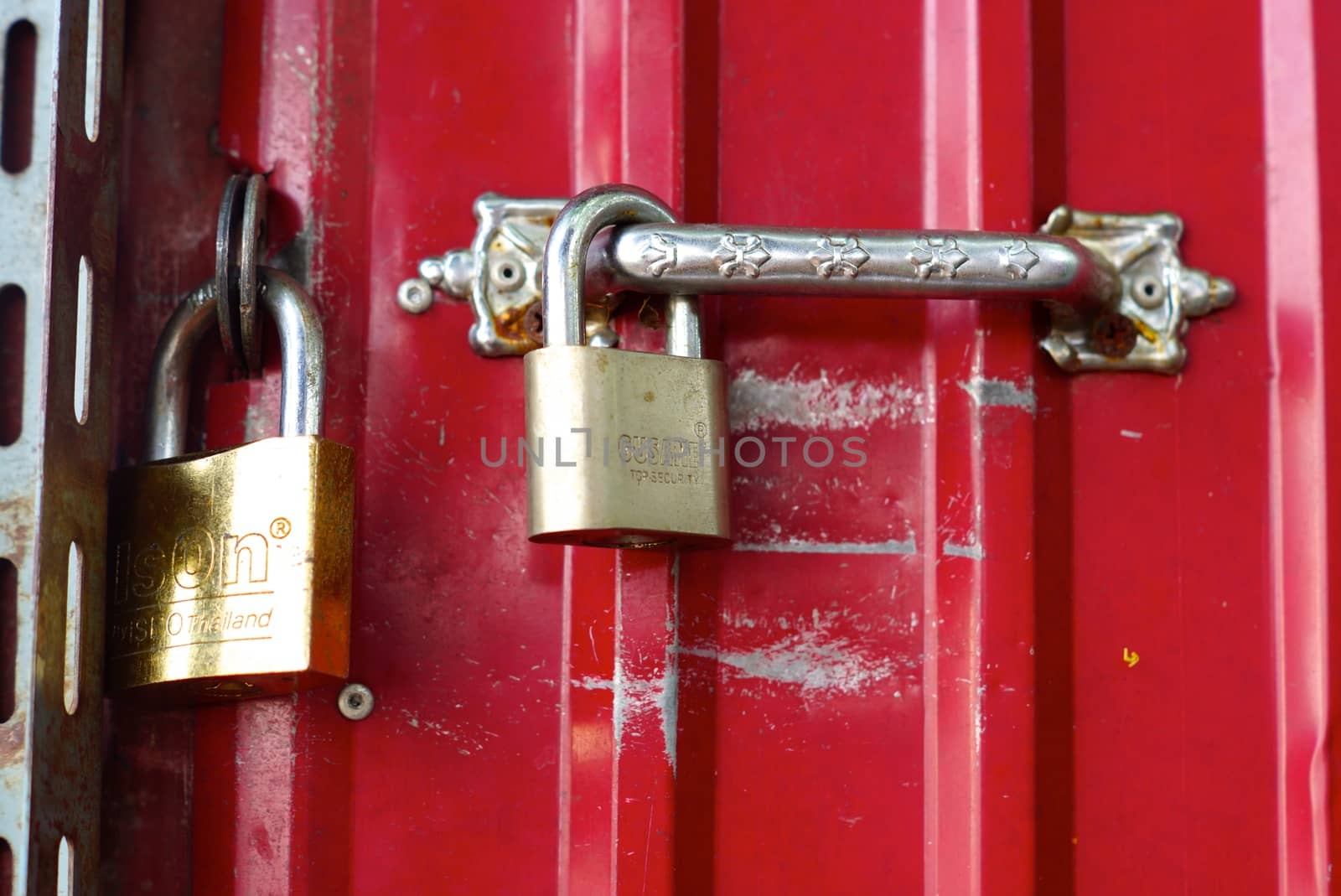 metal master key at wooden door,shallow focus
