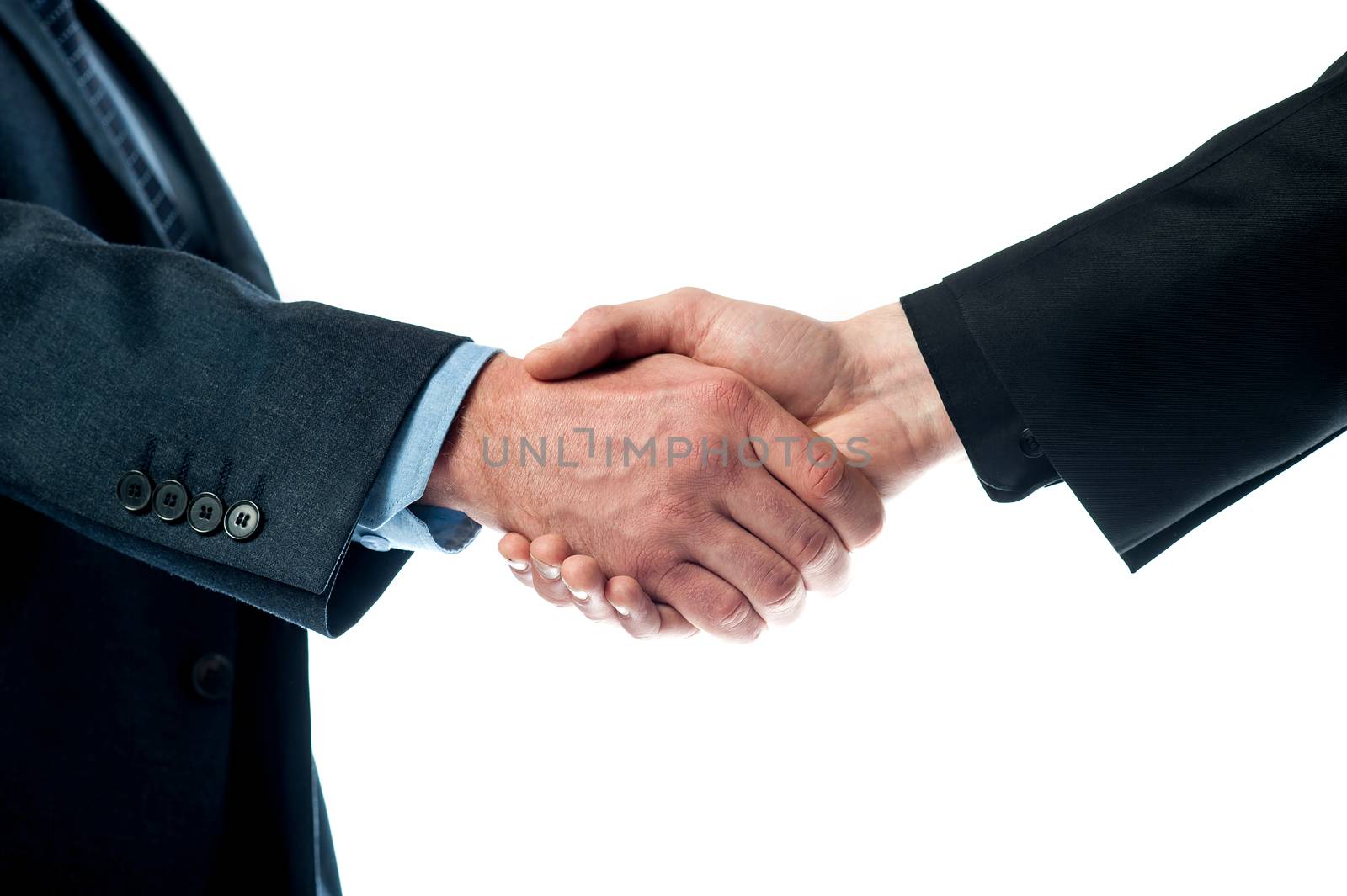 Cropped image of business people shaking hands