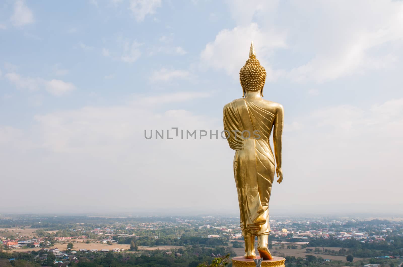 Buddha standing on a mountain Wat Phra That Khao Noi by Sorapop