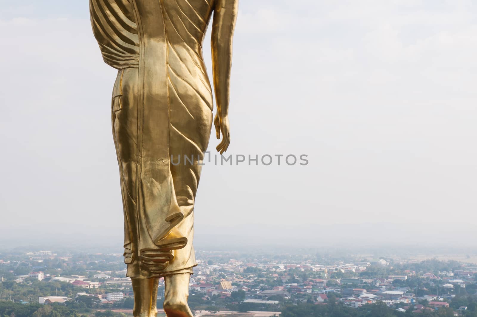 Buddha standing on a mountain Wat Phra That Khao Noi by Sorapop