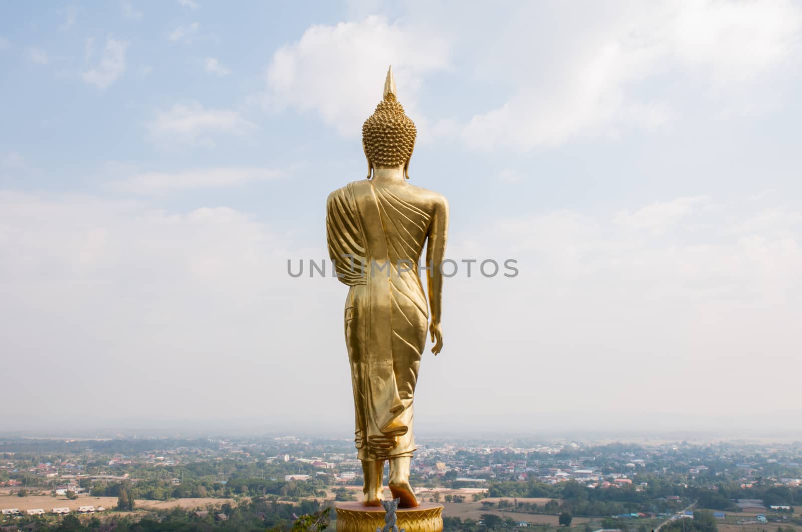 Buddha standing on a mountain Wat Phra That Khao Noi by Sorapop