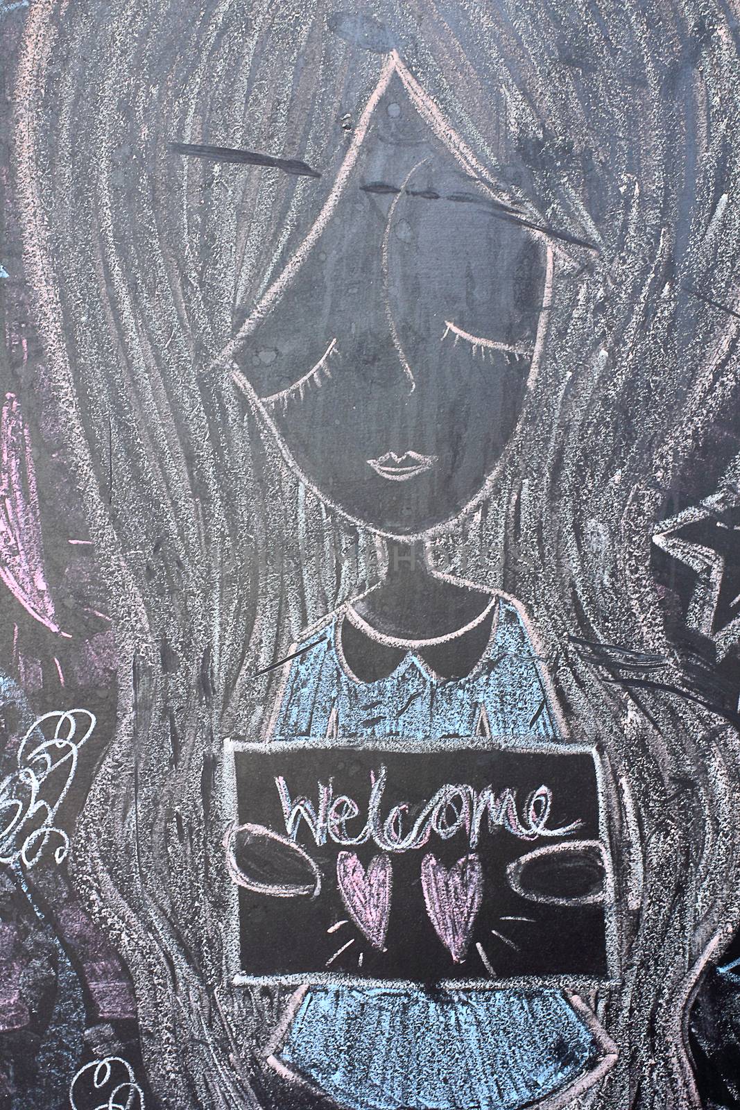 Chalk handwriting woman and welcome on Blackboard