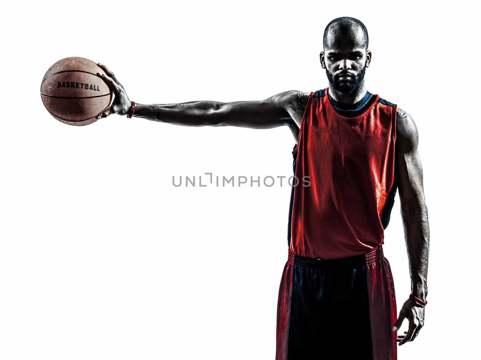 one african man basketball player holding ball in silhouette isolated white background