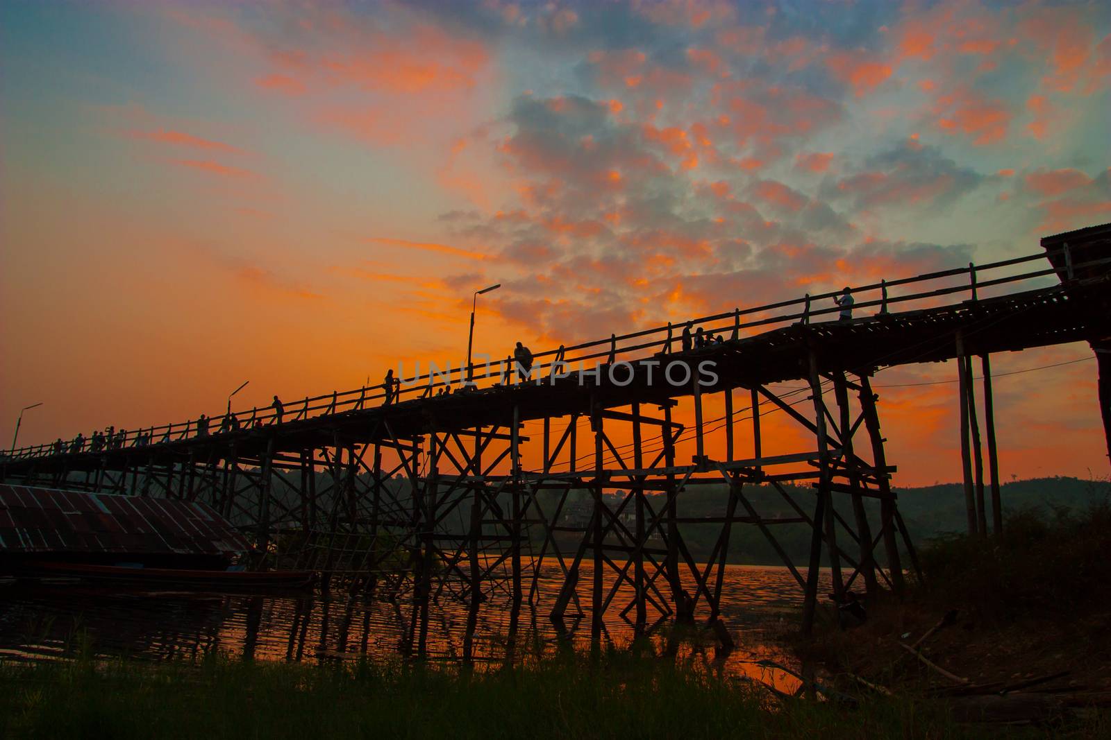 Evening sunlight on a wooden bridge.