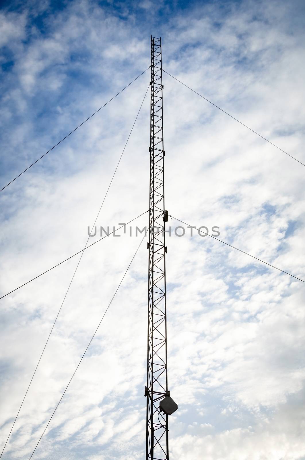 Telecommunication pylon against a sky background