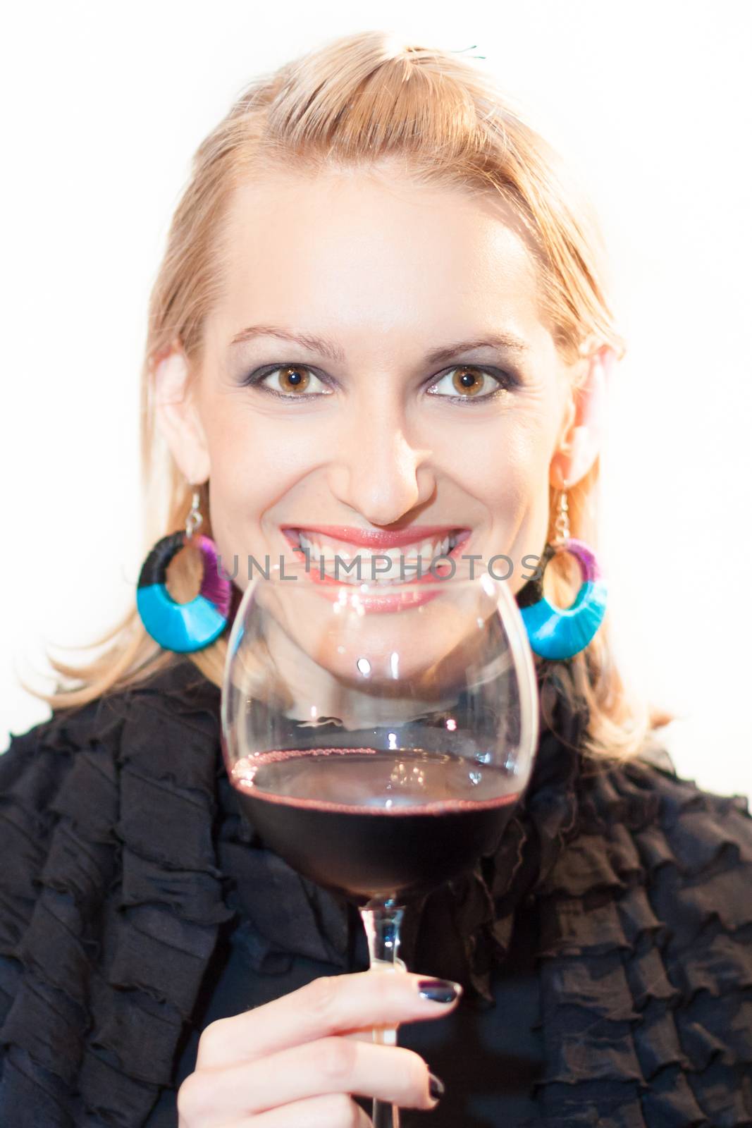 Business woman toasting with a glass of red wine.