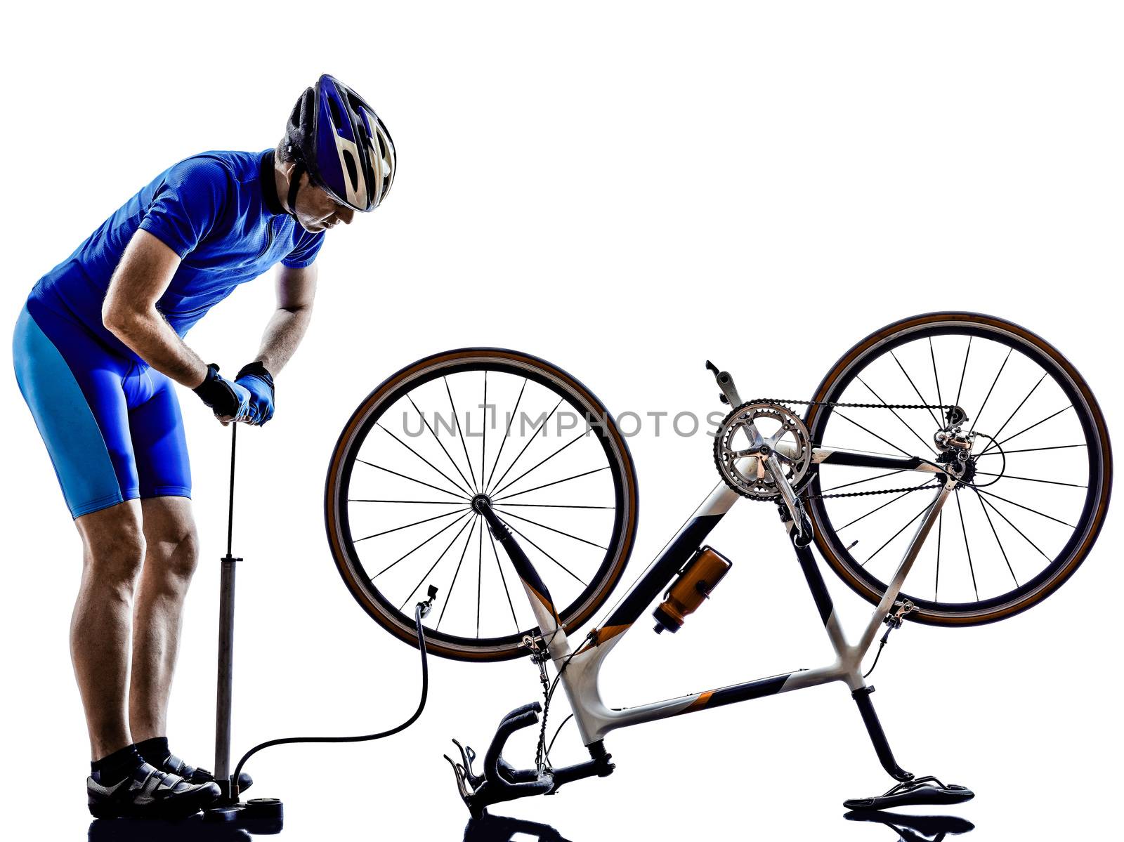 cyclist repairing bicycle  in silhouettes on white background