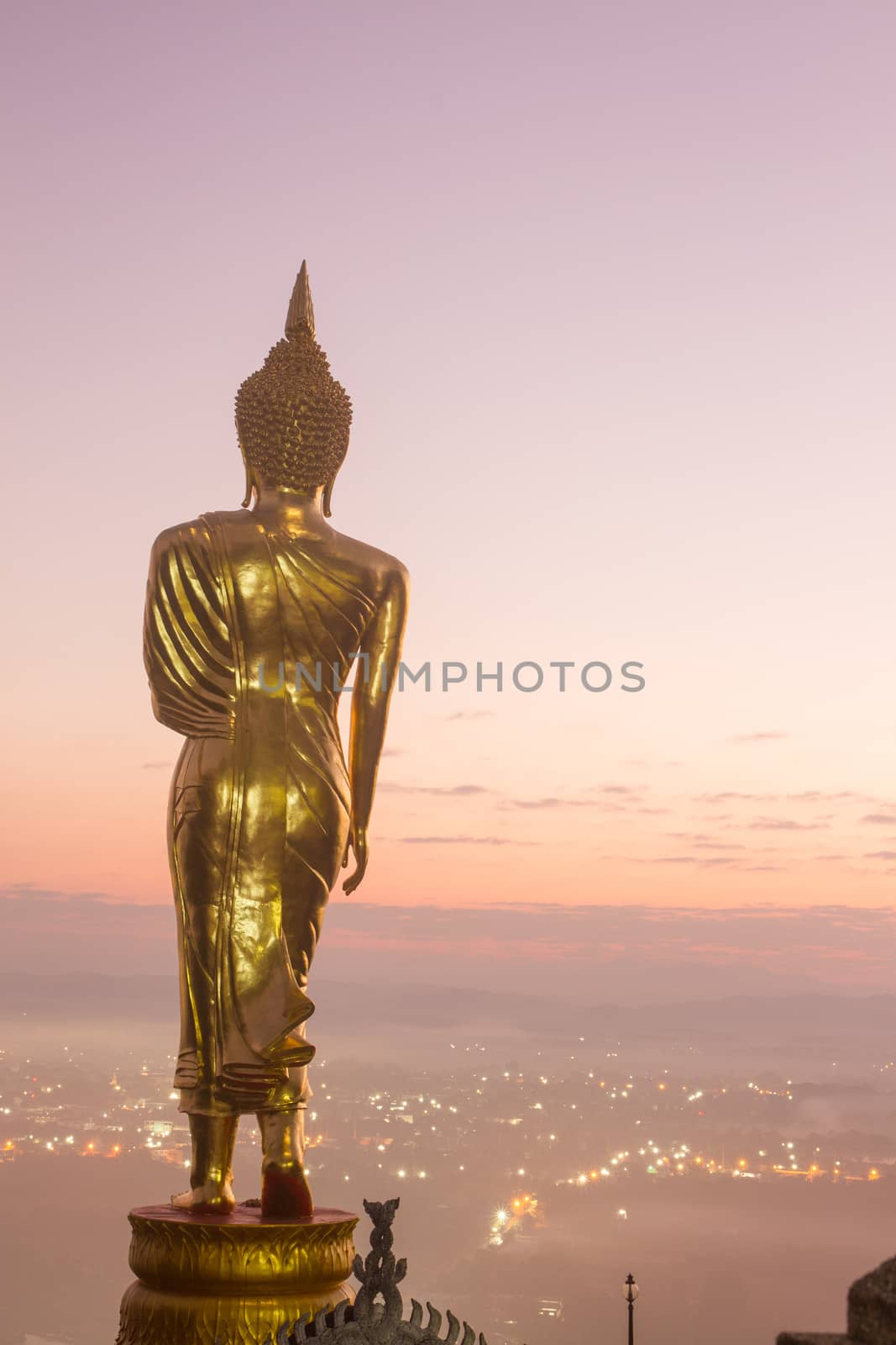 Buddha standing on a mountain Wat Phra That Khao Noi, Nan Province, Thailand