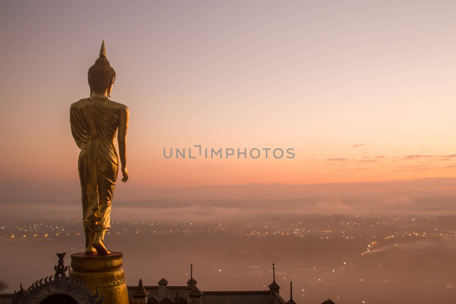 Buddha standing on a mountain Wat Phra That Khao Noi, Nan Province, Thailand