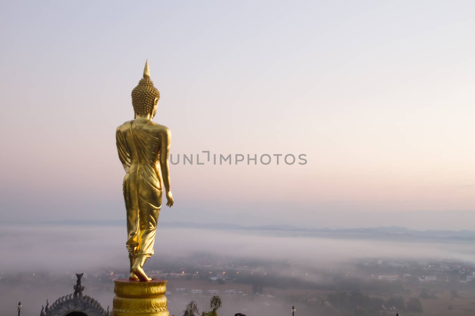 Buddha standing on a mountain Wat Phra That Khao Noi, Nan Province, Thailand