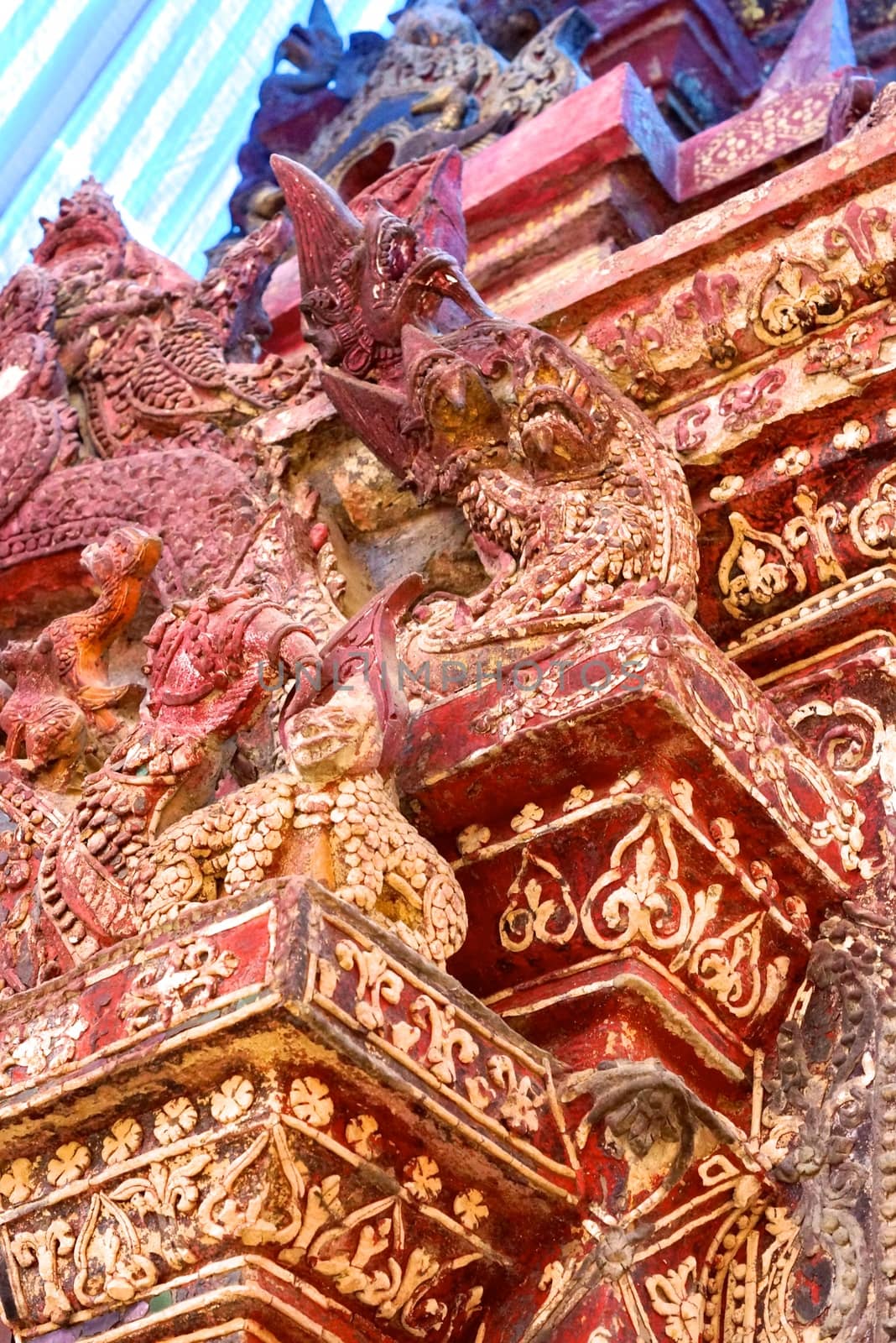 ancient complicated stucco work showing of traditional thai pattern that decorated with mirror and precious stone,Lampang temple,Thailand