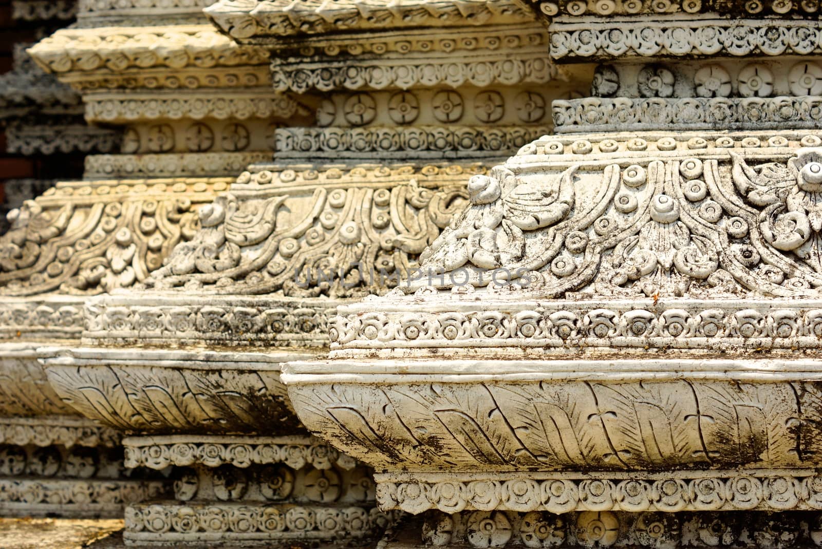 ancient stucco work at front gate of Lampang temple ,Lampang,Thailand