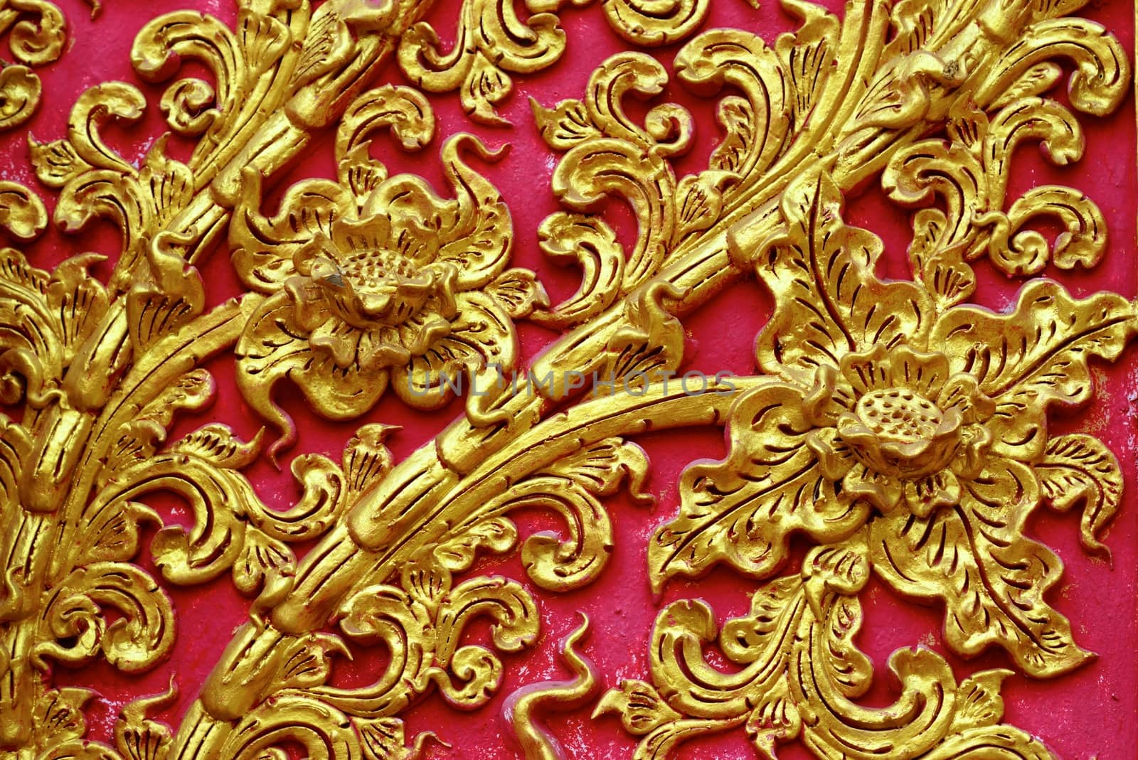 high complicated stucco work showing of traditional thai pattern that decorated with mirror and precious stone,Lampang temple,Thailand