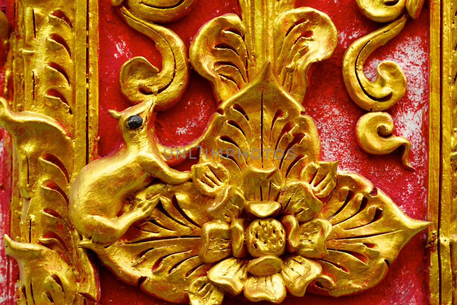  stucco work showing of traditional thai pattern that decorated with mirror and precious stone,Lampang temple,Thailand