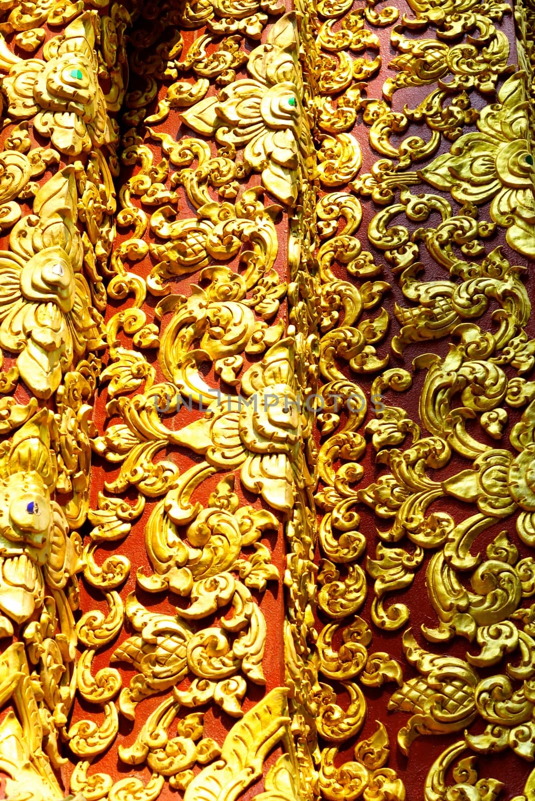 stucco work in thai art that usually decorated with mirror and precious stone or gold leaf,Chiang rai temple,Thailand